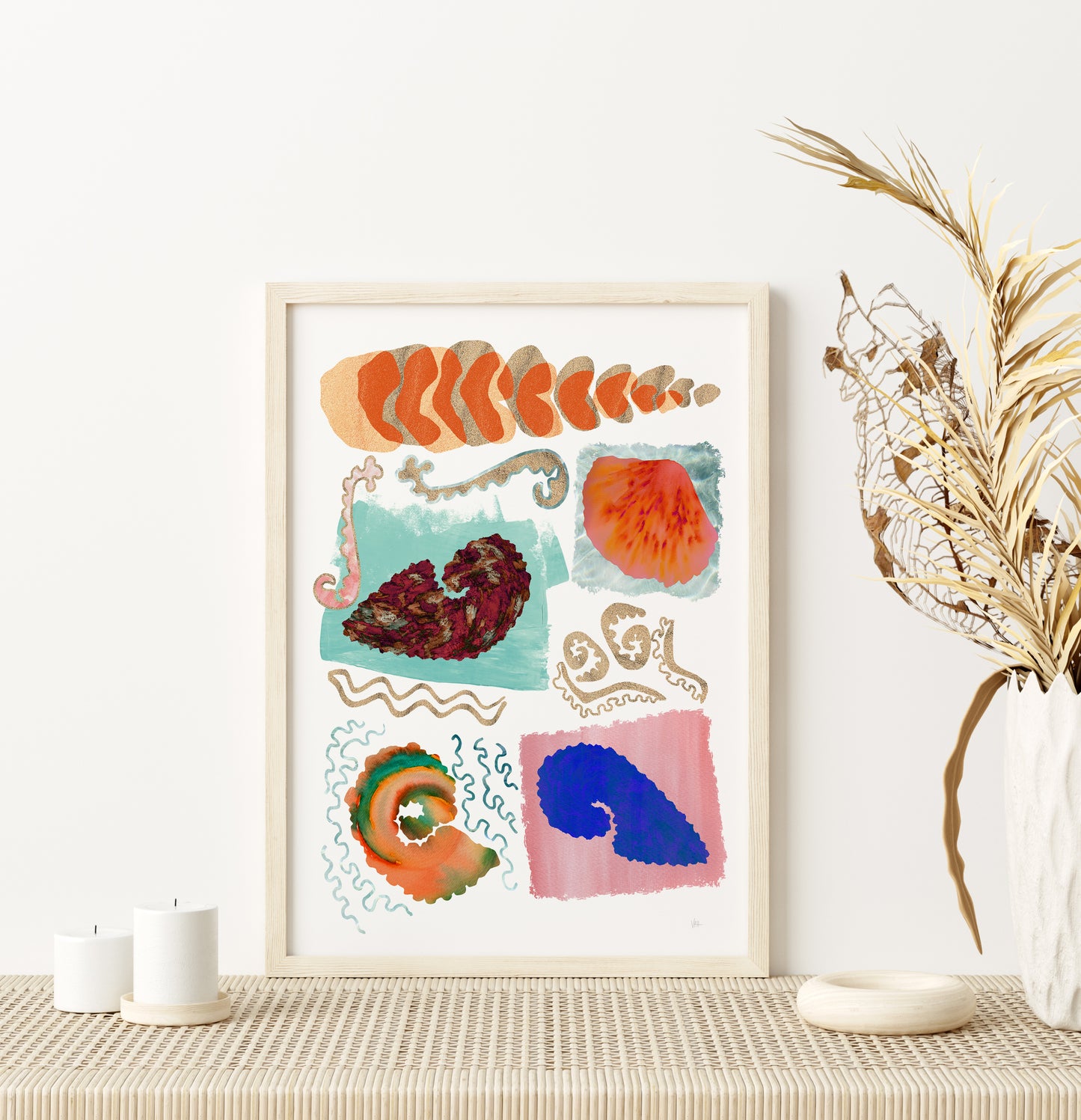Framed abstract artwork on a wall with decorative elements.