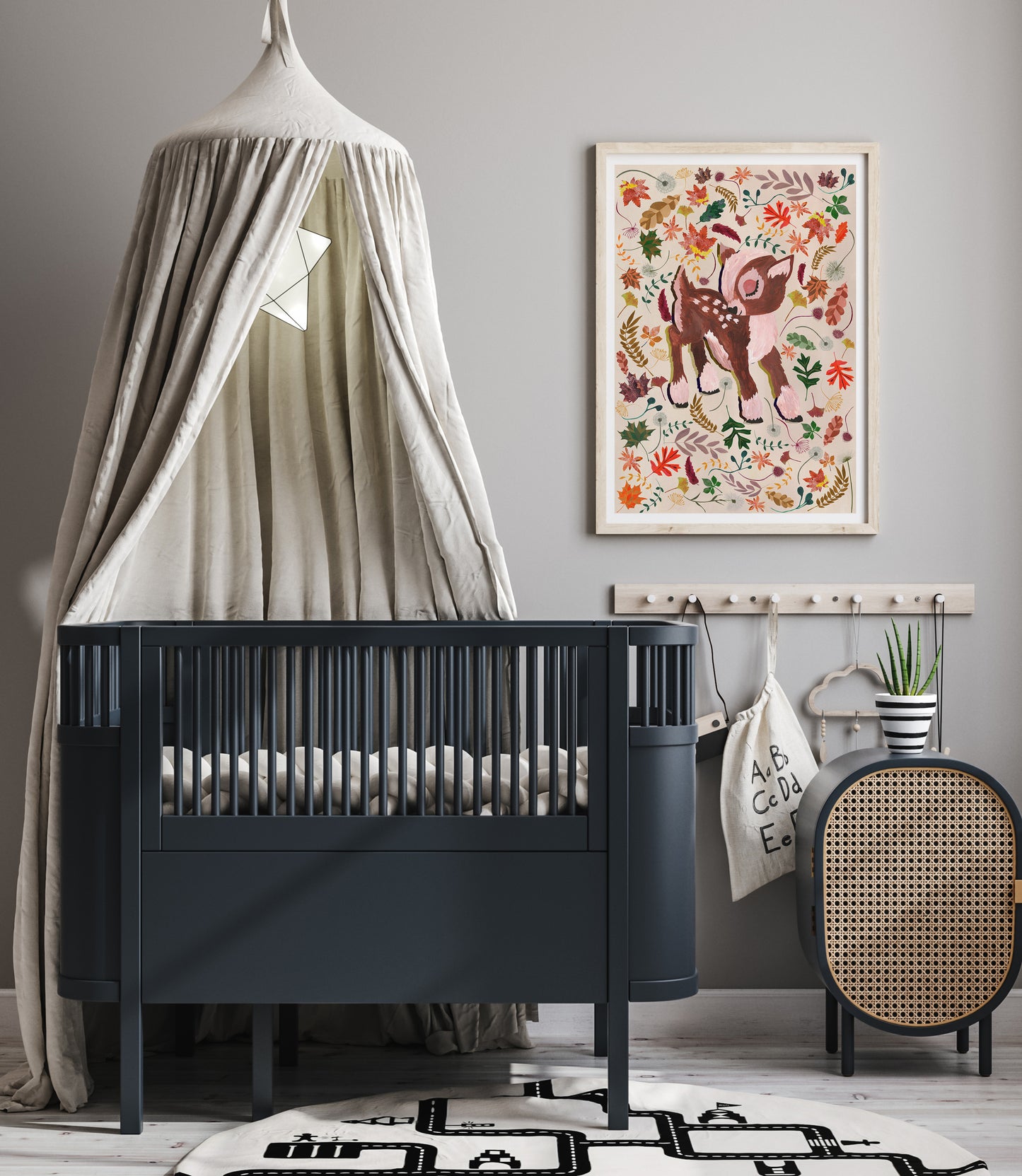 Nursery room with a black crib, decorative wall art, and a round rug.