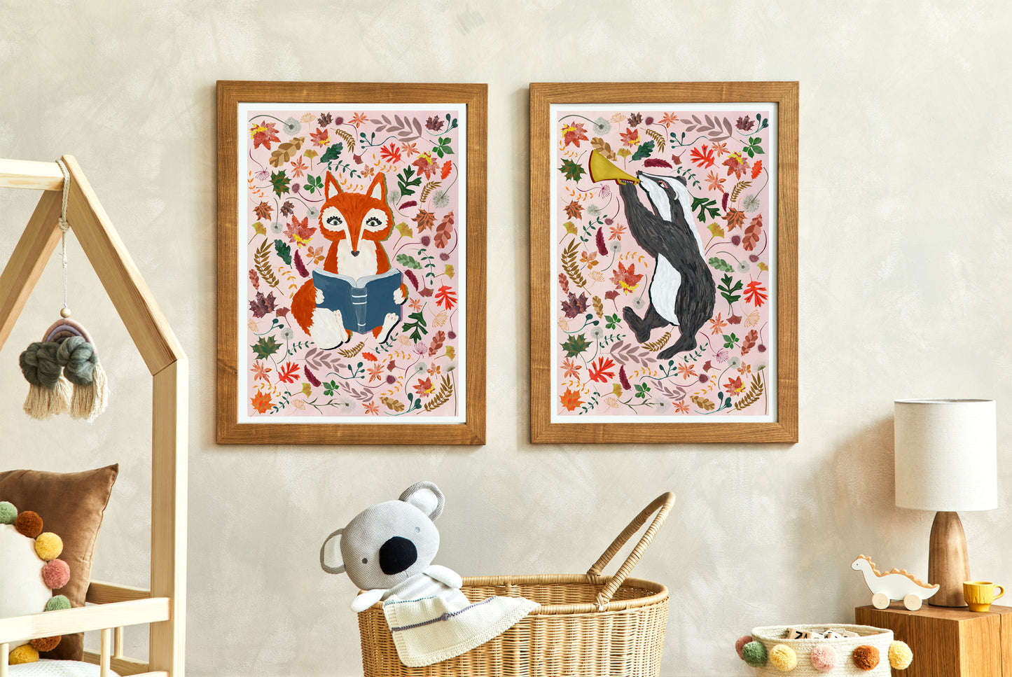 Two framed animal prints on a wall with a child's toy and basket below.