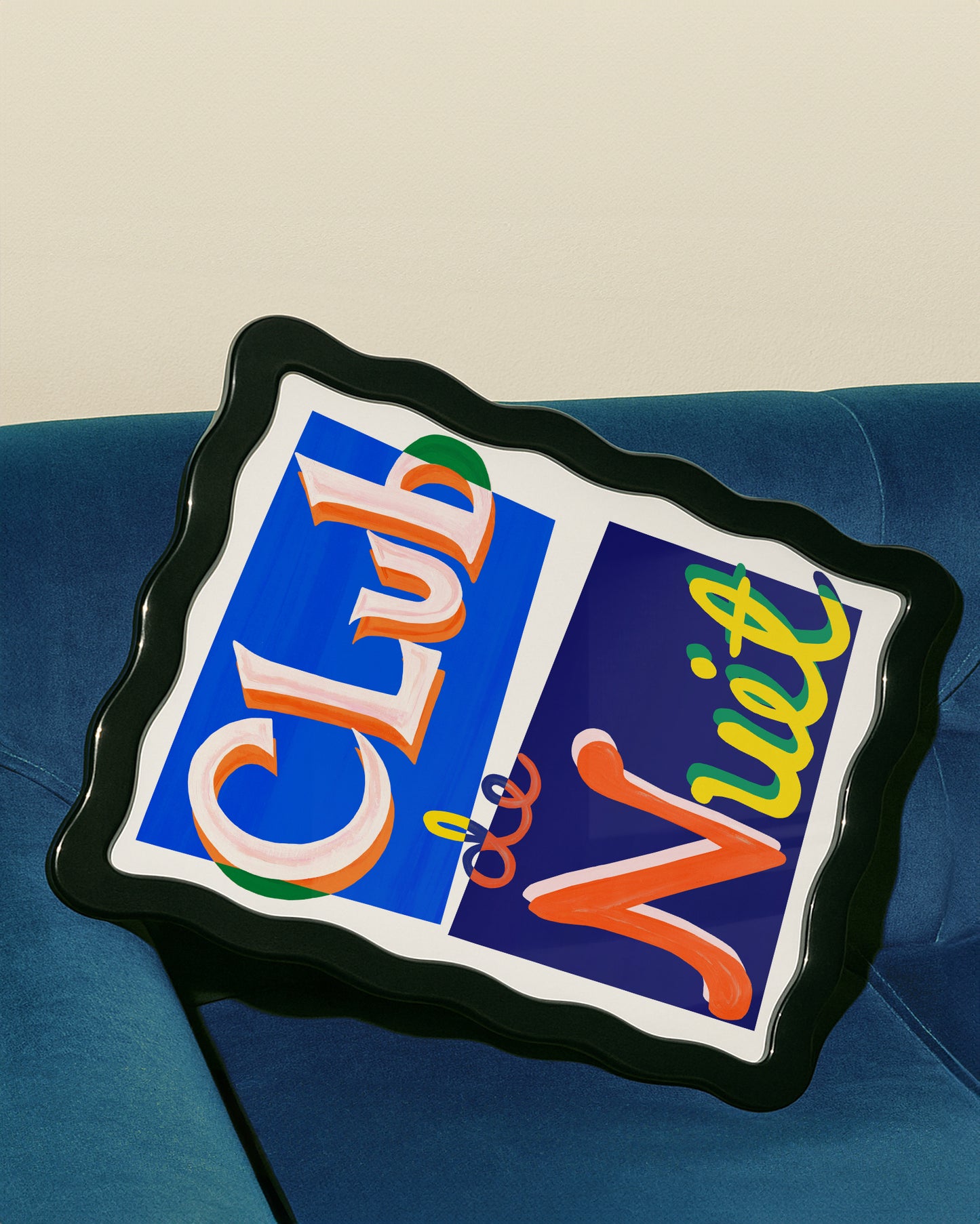 Colorful 'Club' and 'Liquor' sign on a blue couch