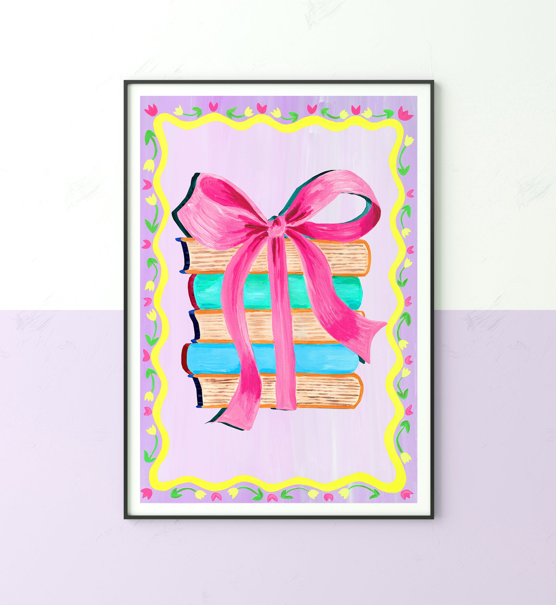 Framed artwork of books with a pink ribbon on a light purple background