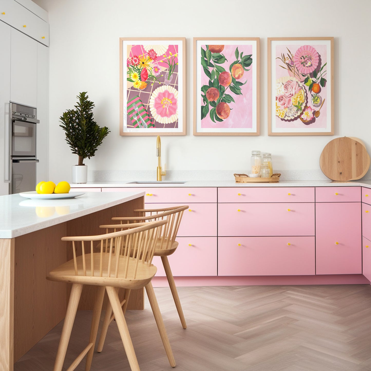 a pink modern kitchen with pinkand grren fruit and still life wall art set above the sink