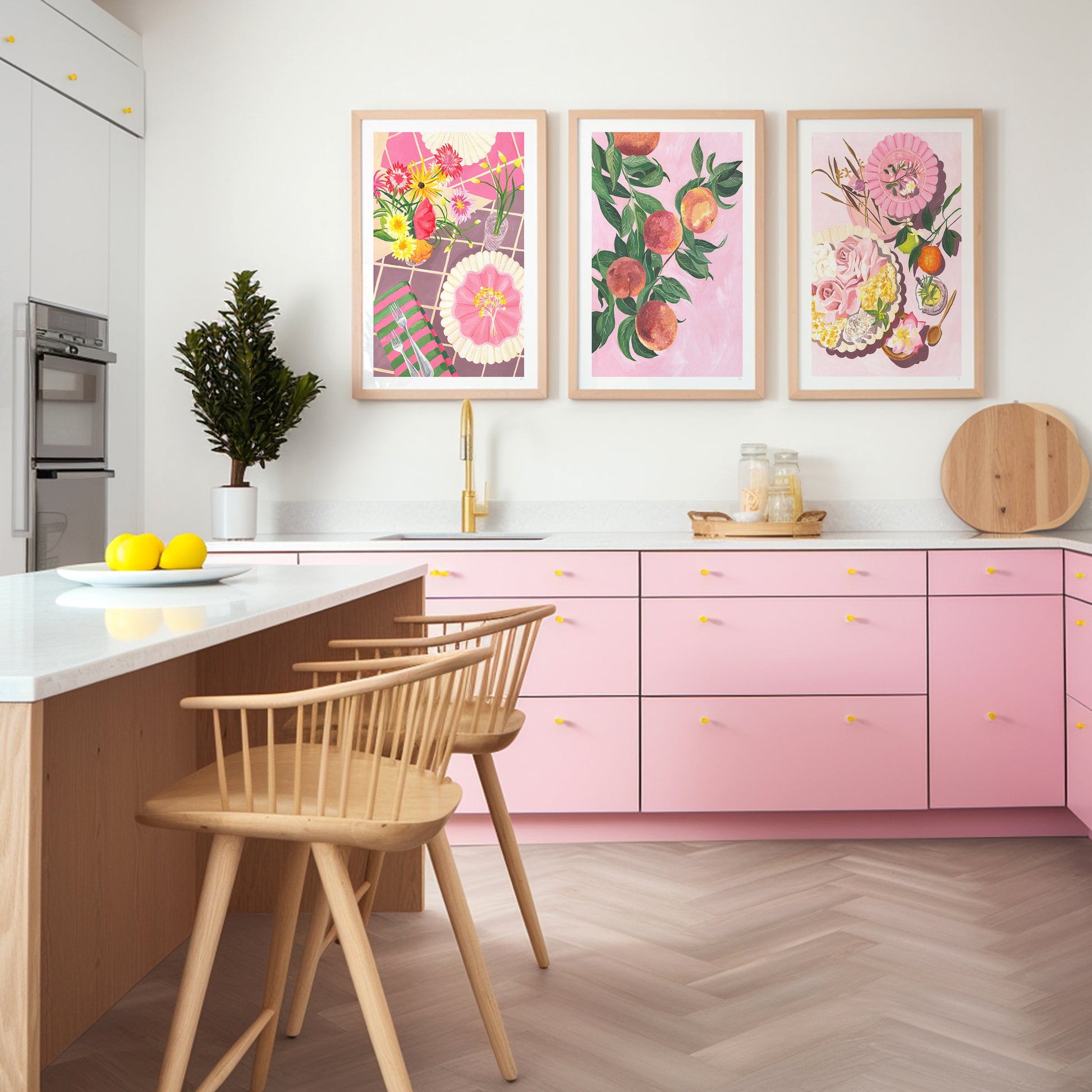 a pink modern kitchen with pinkand grren fruit and still life wall art set above the sink