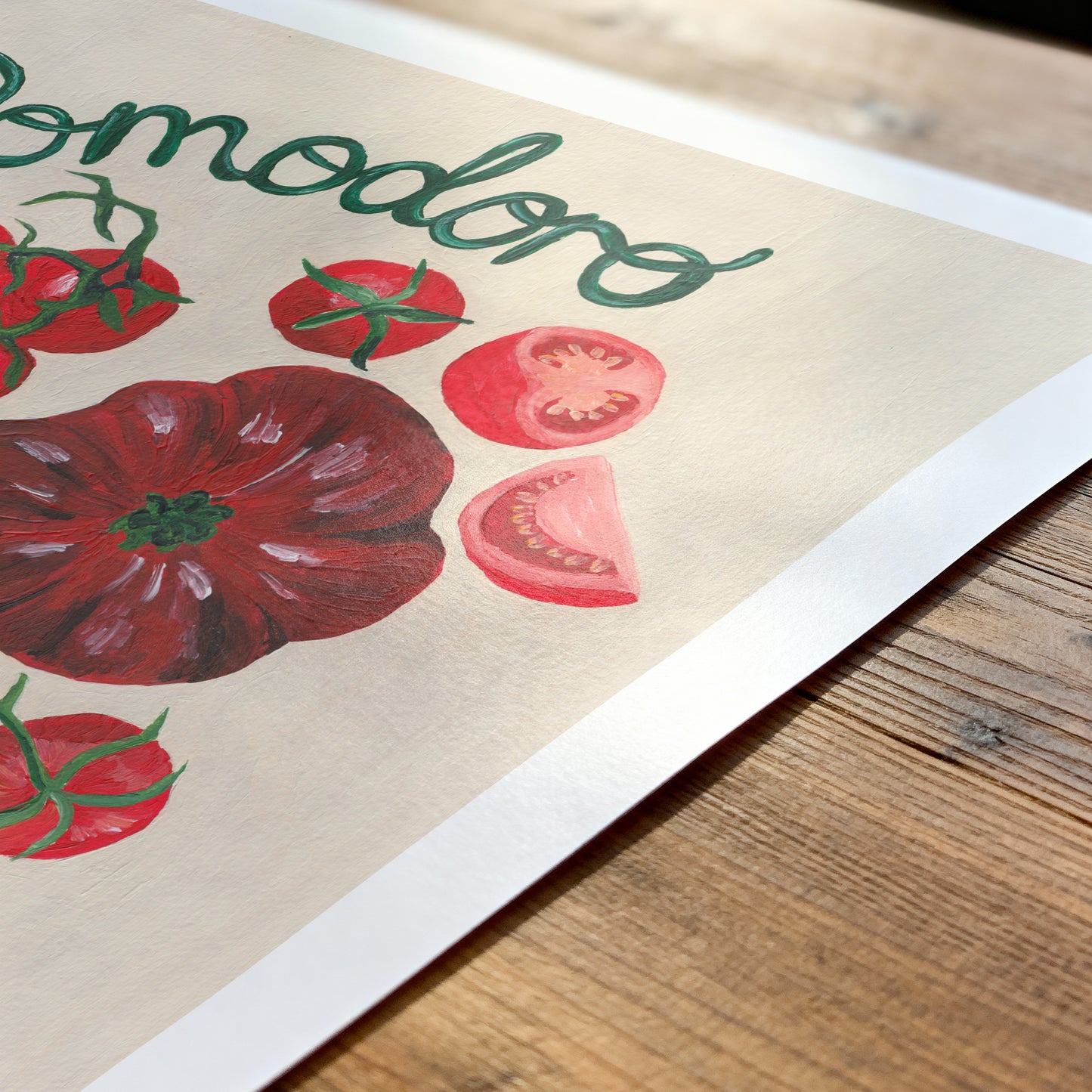 Poster with tomato illustrations and 'Tomodoro' text on a wooden surface