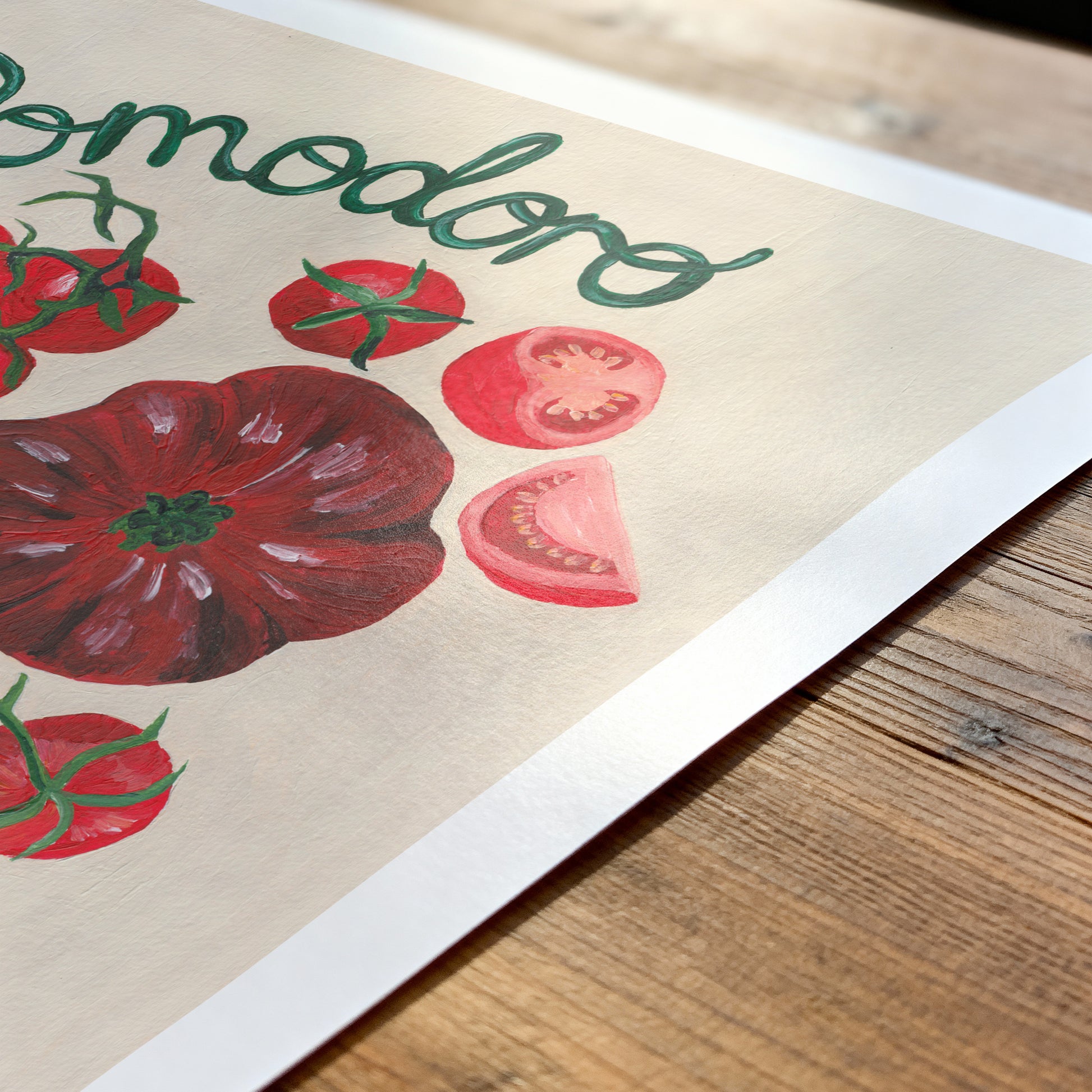 Poster with tomato illustrations and 'Tomodoro' text on a wooden surface