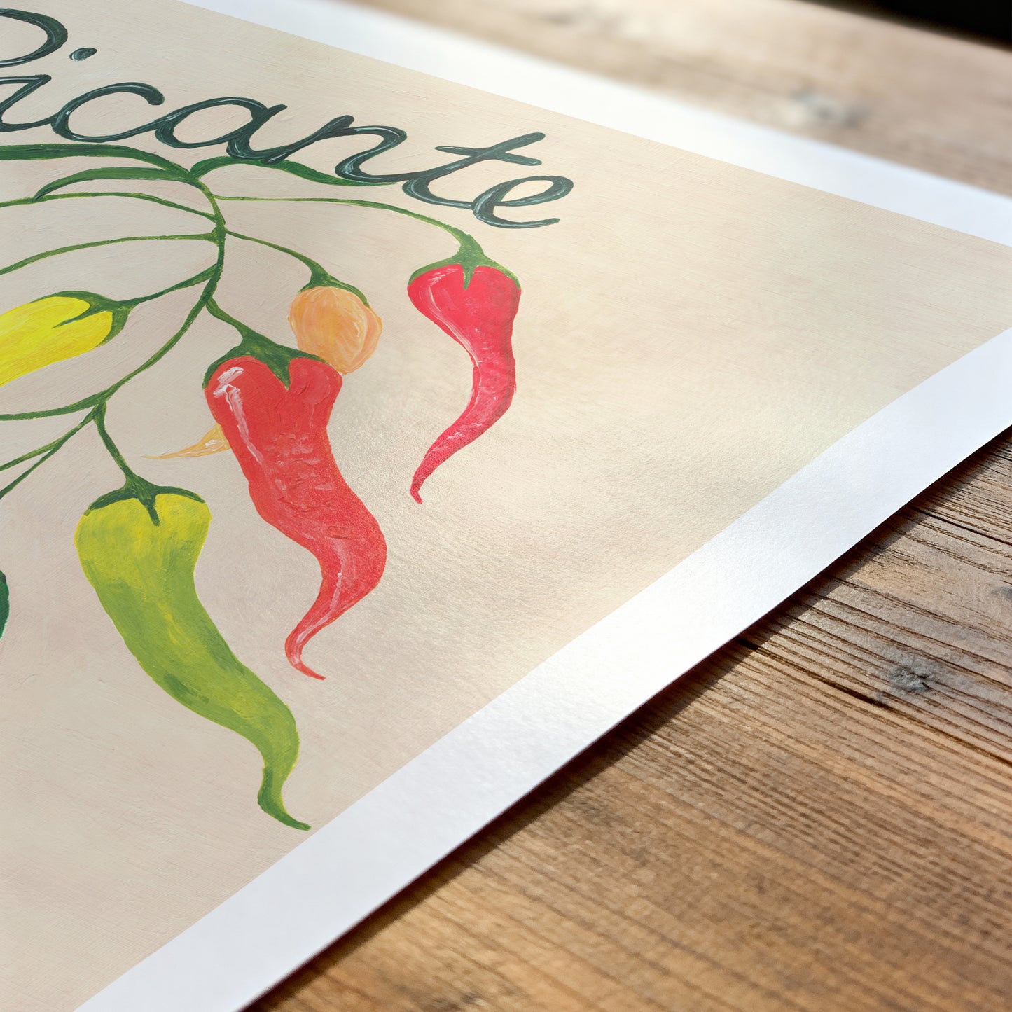 Illustration of colorful peppers with the word 'picante' on a wooden surface