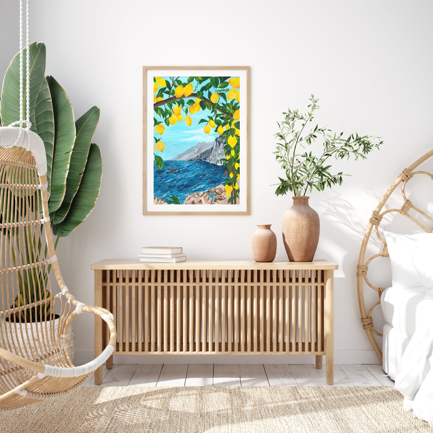 Modern interior with a wooden console table, decorative vases, and a framed artwork of a coastal scene.