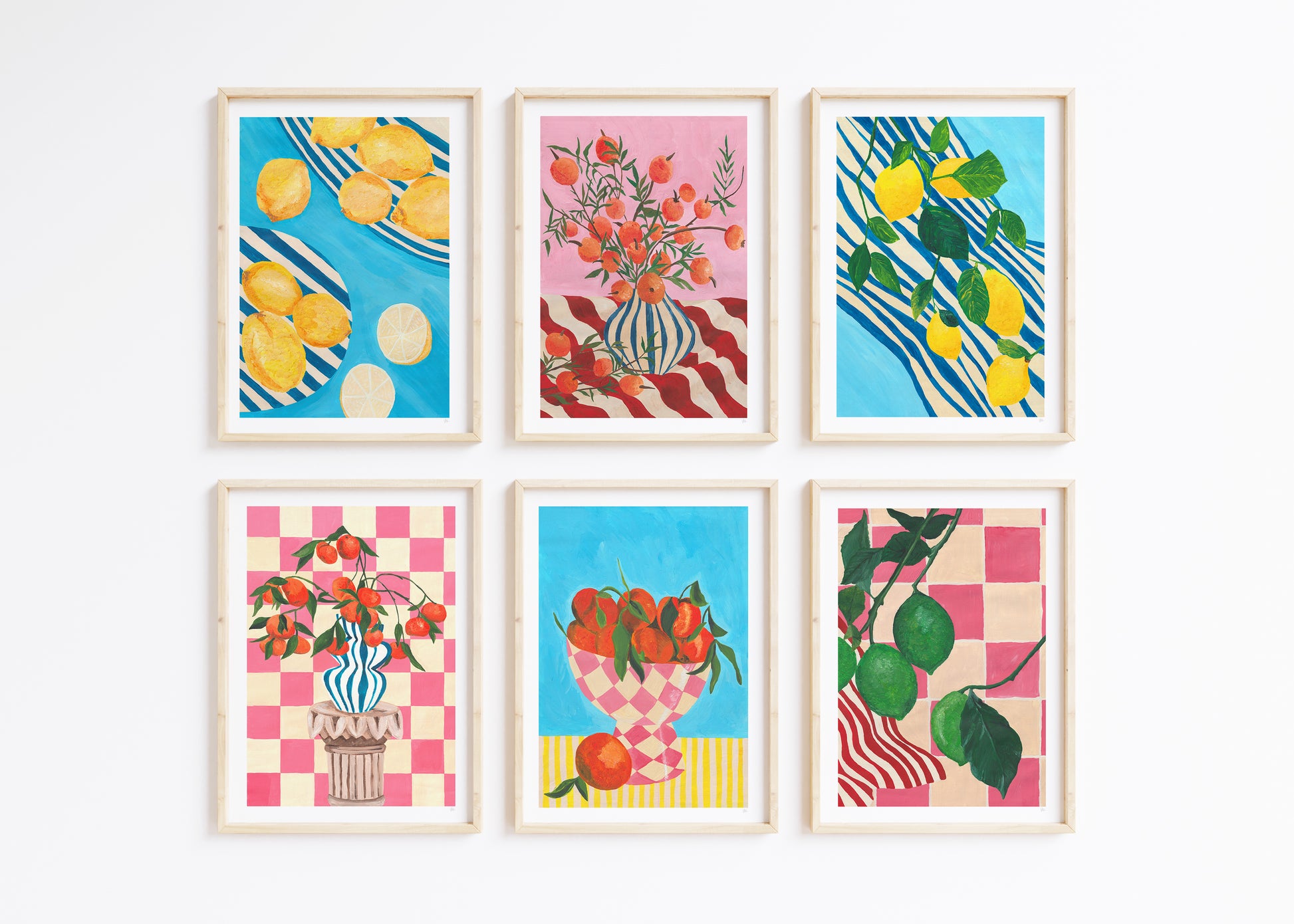 Set of six colourful citrus fruit framed artworks on a white background