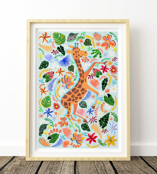 Framed artwork of a giraffe among colorful flowers and leaves on a white wall.