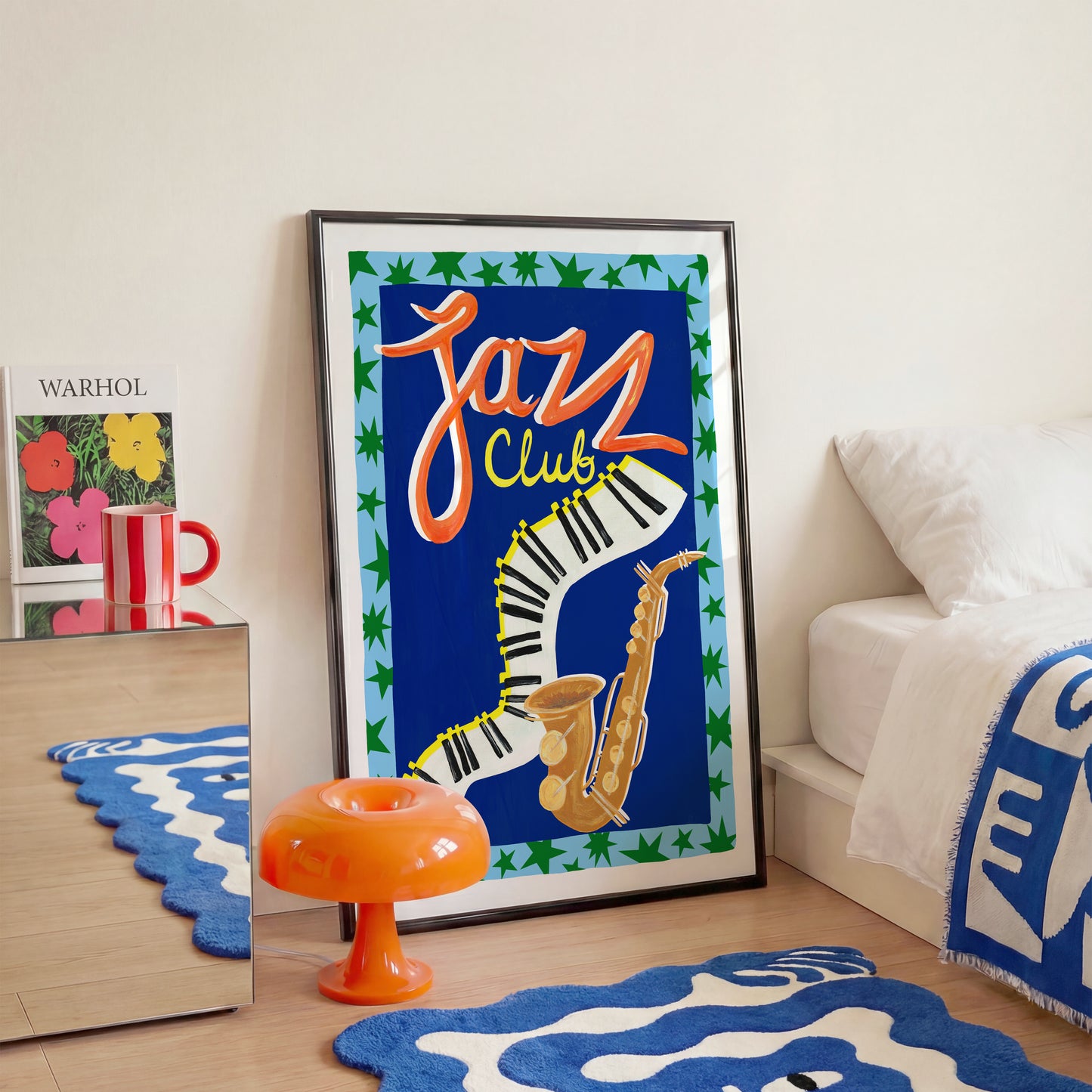 Framed 'Jazz Club' poster in a room with decorative items.