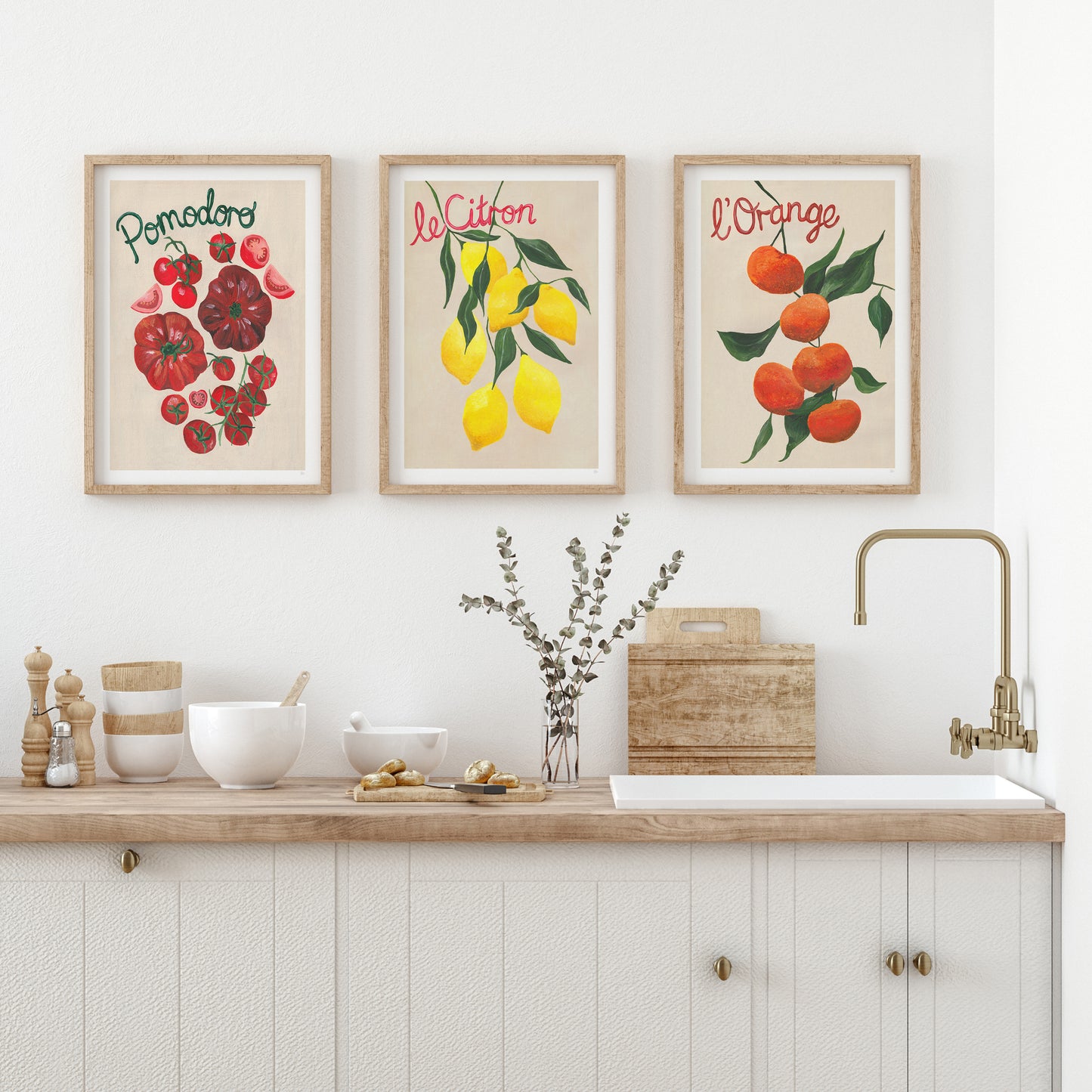 Kitchen with fruit-themed wall art above a countertop.