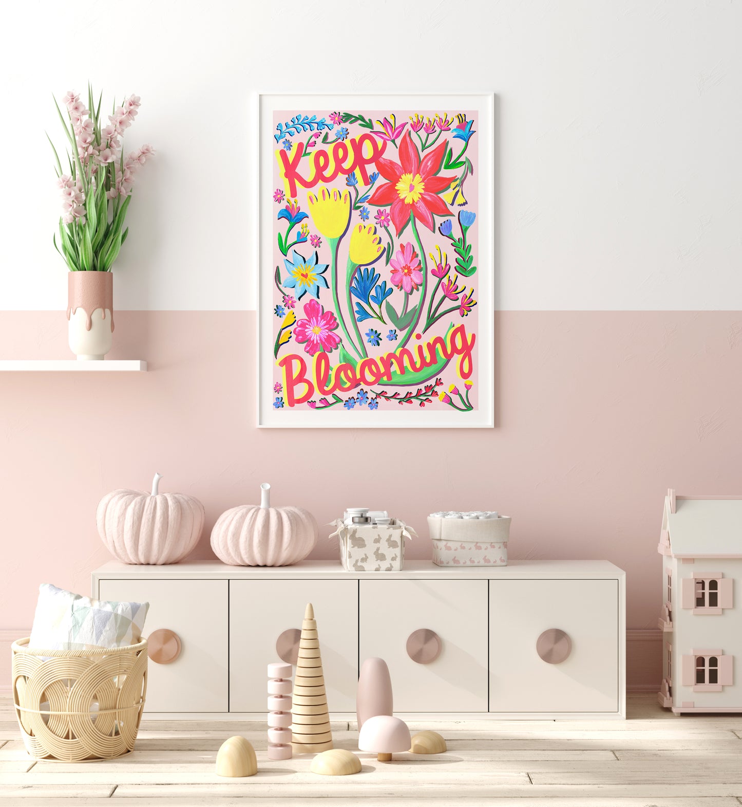 Colorful floral wall art with 'Keep Blooming' text in a child's room.