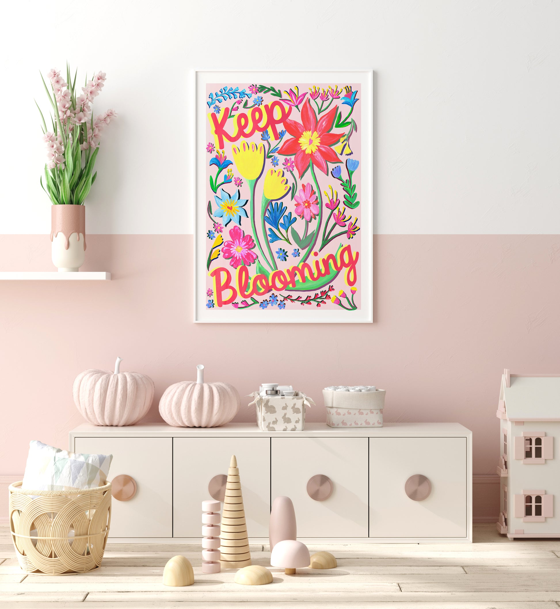 Colorful floral wall art with 'Keep Blooming' text in a child's room.