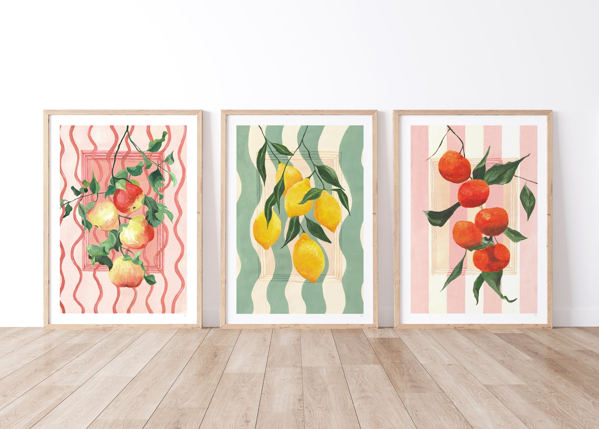 set of hand painted fruit prints one of leafy apples, leafy leomsn and leafy oranges with painted striped backgrounds