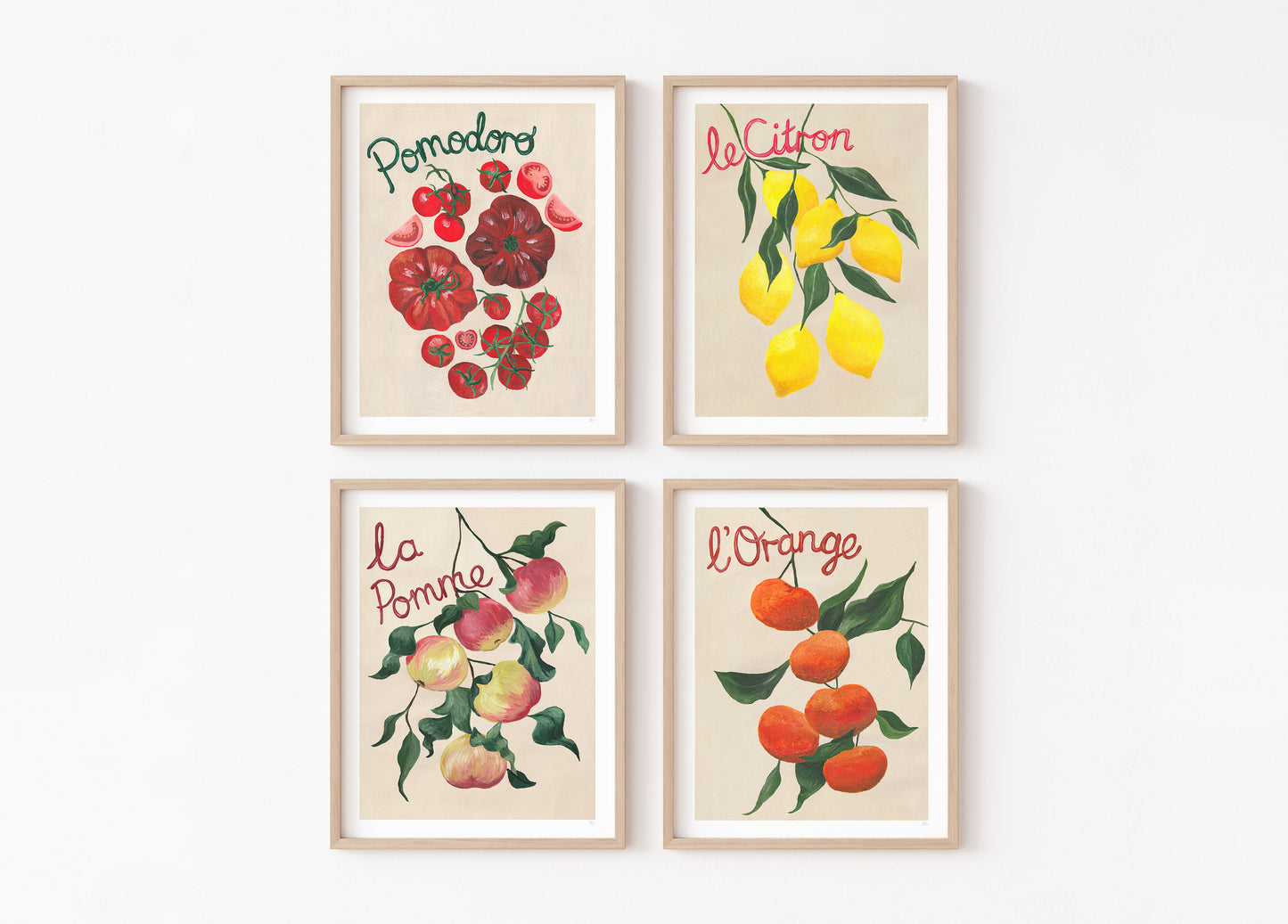 Four framed prints of fruits with text on a white background