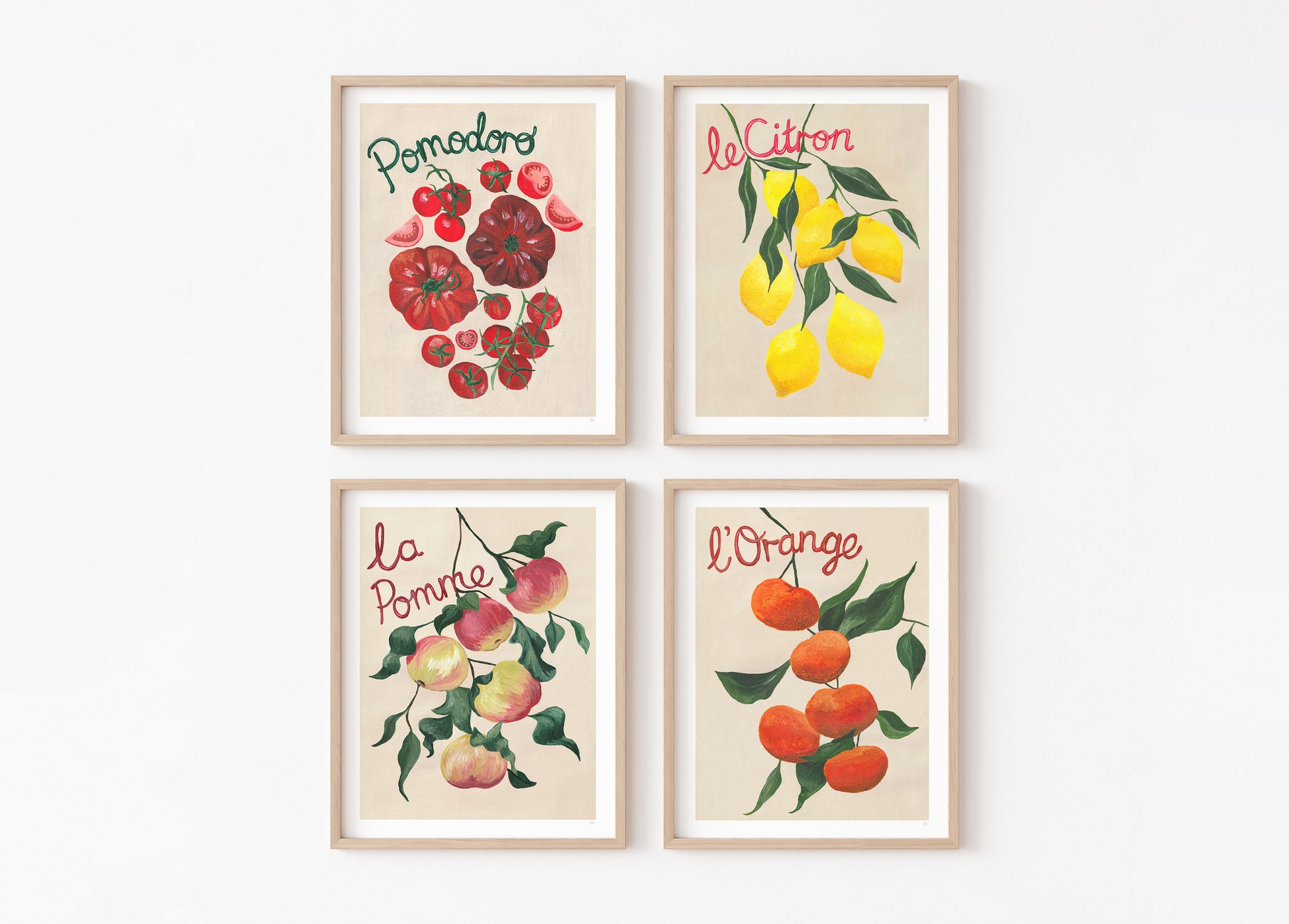 Four framed prints of fruits with text on a white background