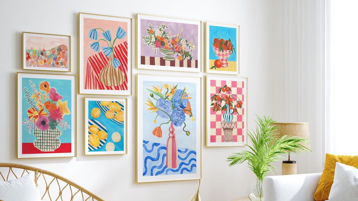 Living room with colorful abstract art on the wall, a white sofa, and a glass coffee table.