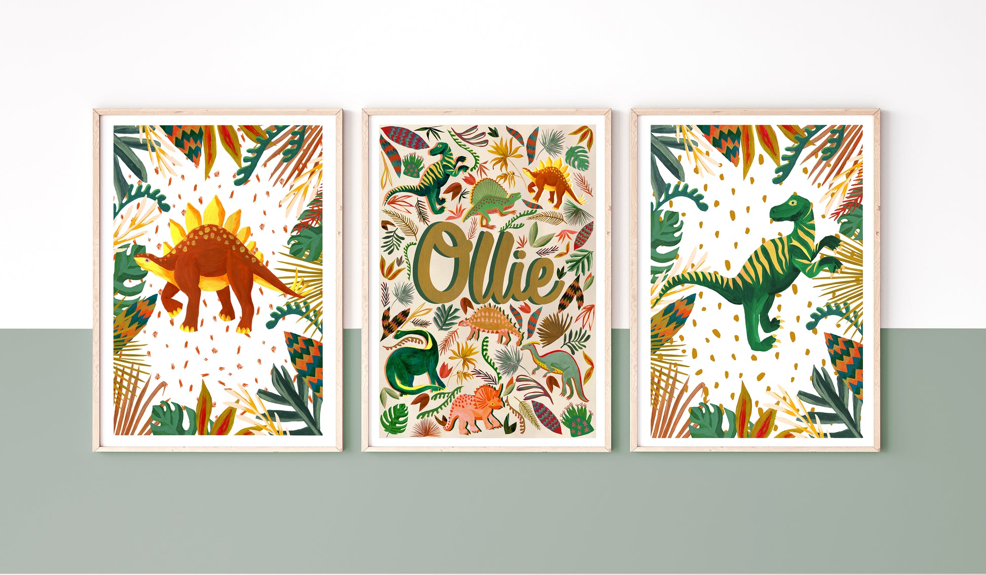 Earth toned Personalised framed name print set in a dinosaur illustrated theme place on a a colourblock wall with a stripe of dark sage green and white