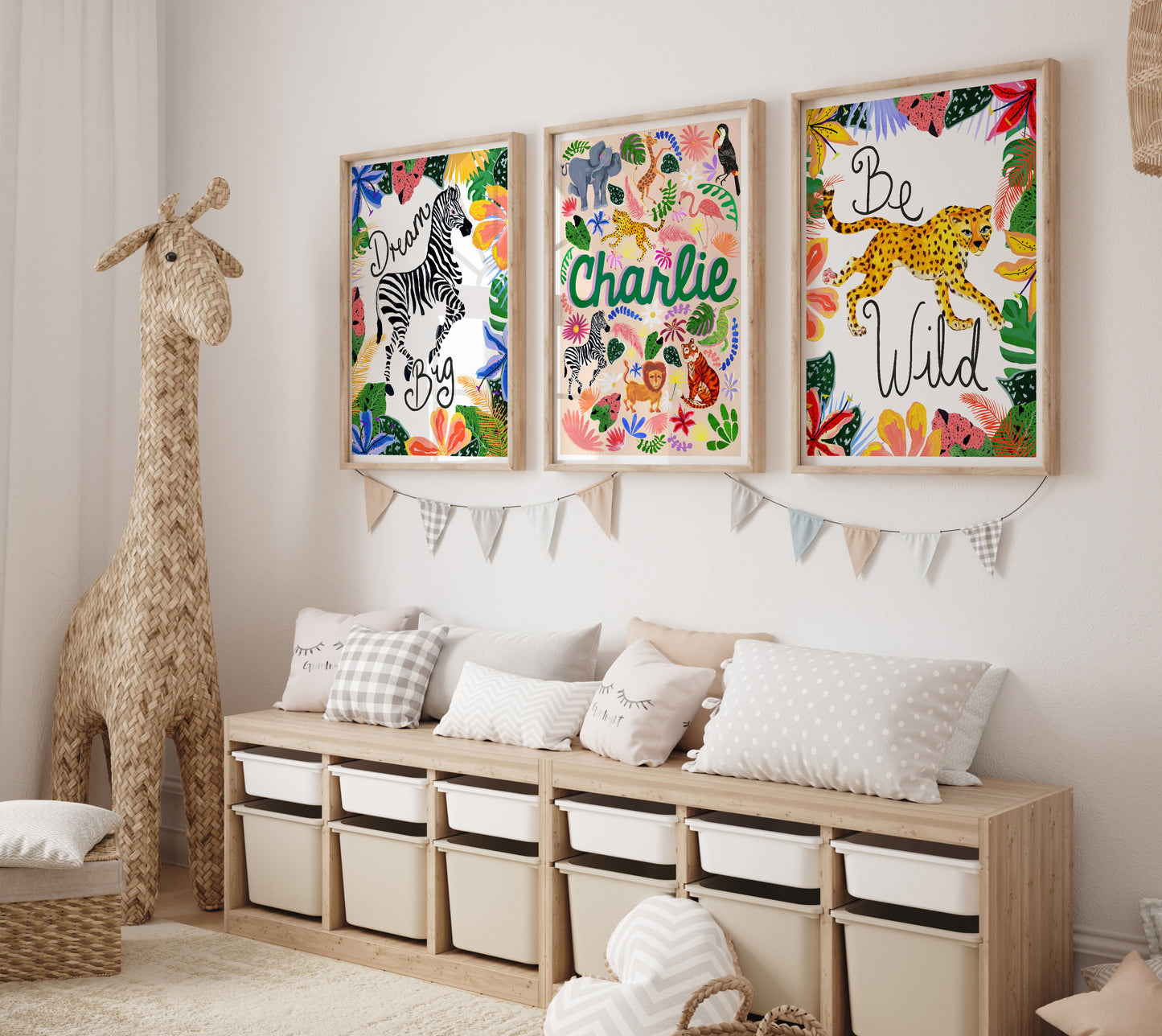 Children's room with colorful wall art, storage unit, and stuffed giraffe.