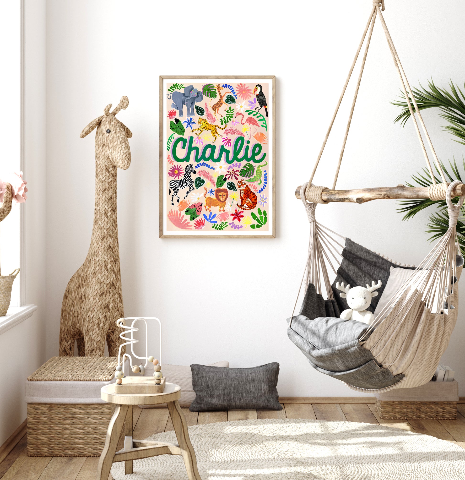 Children's room with a colorful 'Charlie' poster, hammock, and stuffed animals.