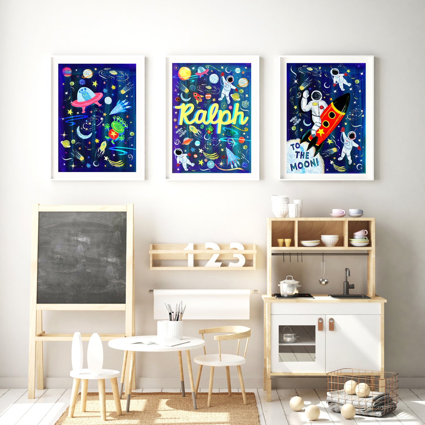 Children's playroom with colorful space-themed wall art and wooden furniture.