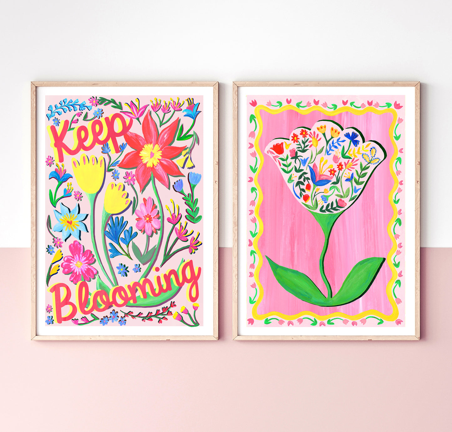 Two colorful floral prints with decorative frames on a pink background