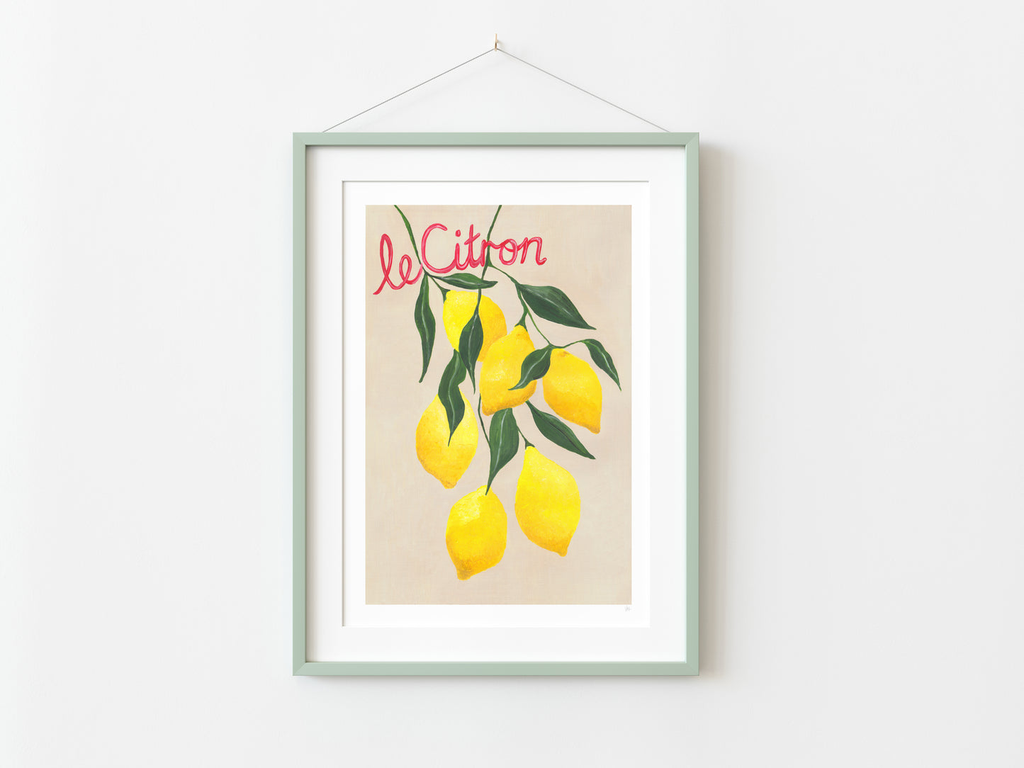 Framed artwork with lemons and 'Le Citron' text on a white wall