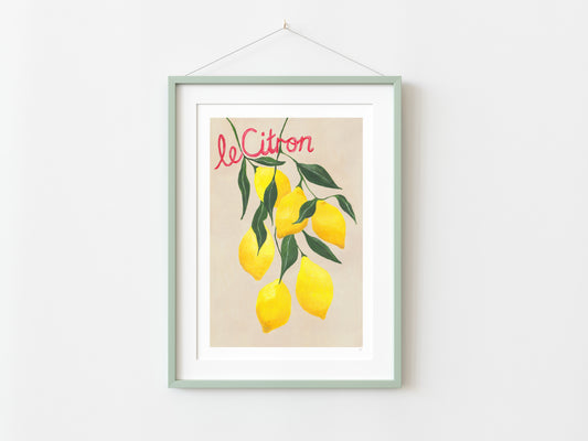 Framed artwork with lemons and 'Le Citron' text on a white wall