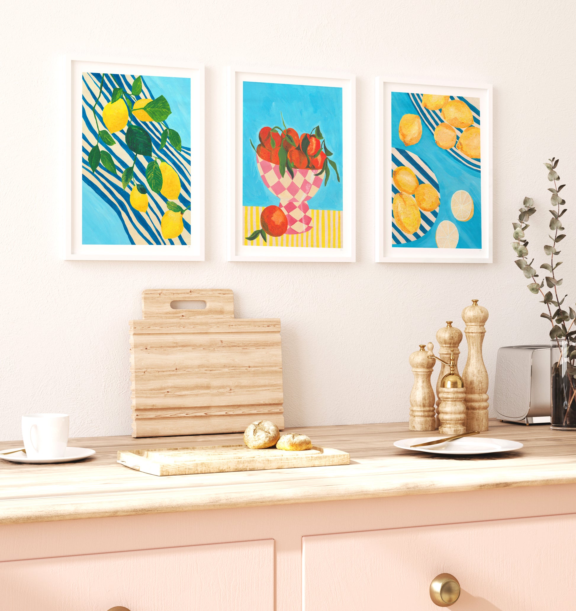 Colorful kitchen wall art above a countertop with cutting boards and decor.