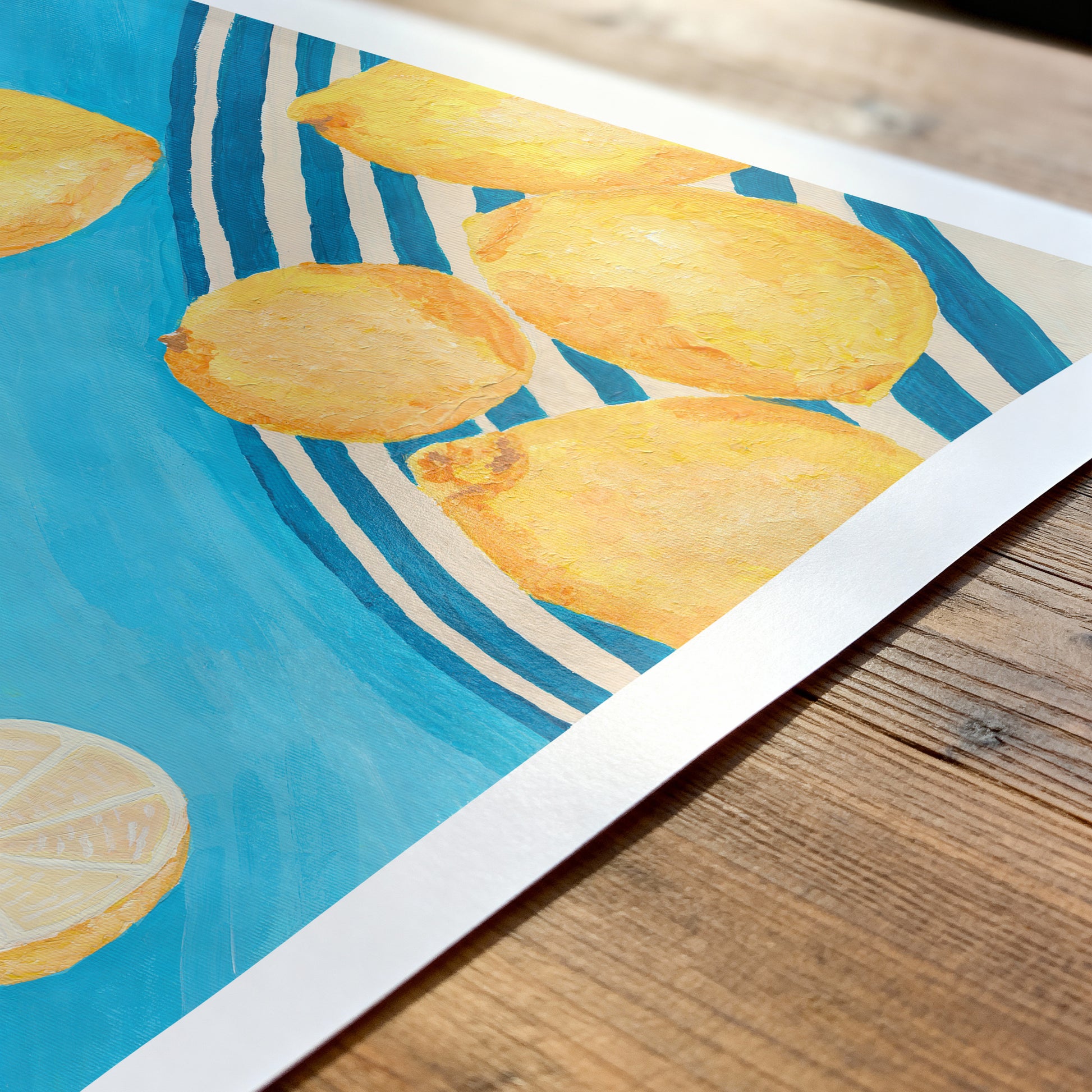Illustration of lemons on a blue and white striped background, placed on a wooden surface.