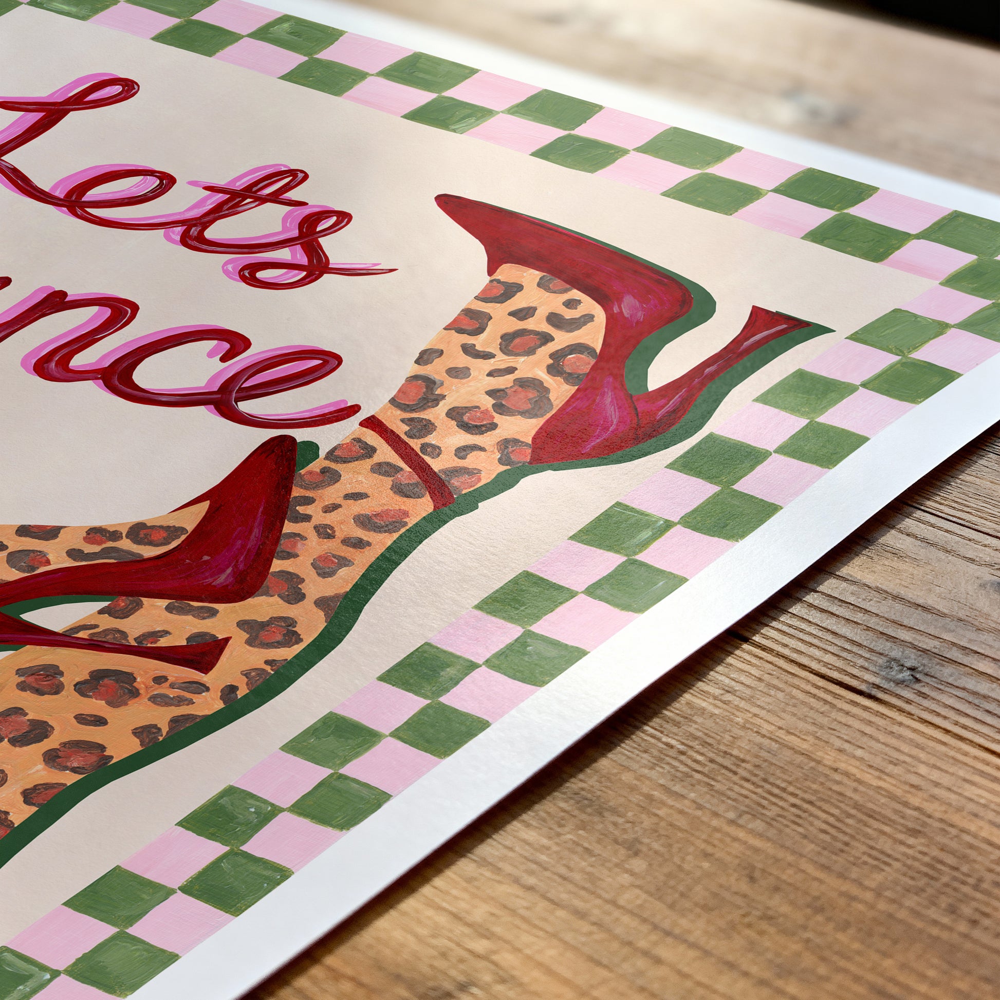 Decorative poster with red high heels, leopard print, and text on a checkered background
