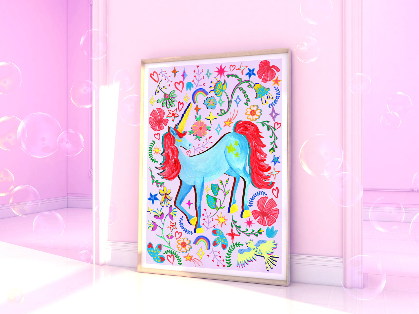 Colorful unicorn illustration in a frame on a pink wall with soap bubbles.