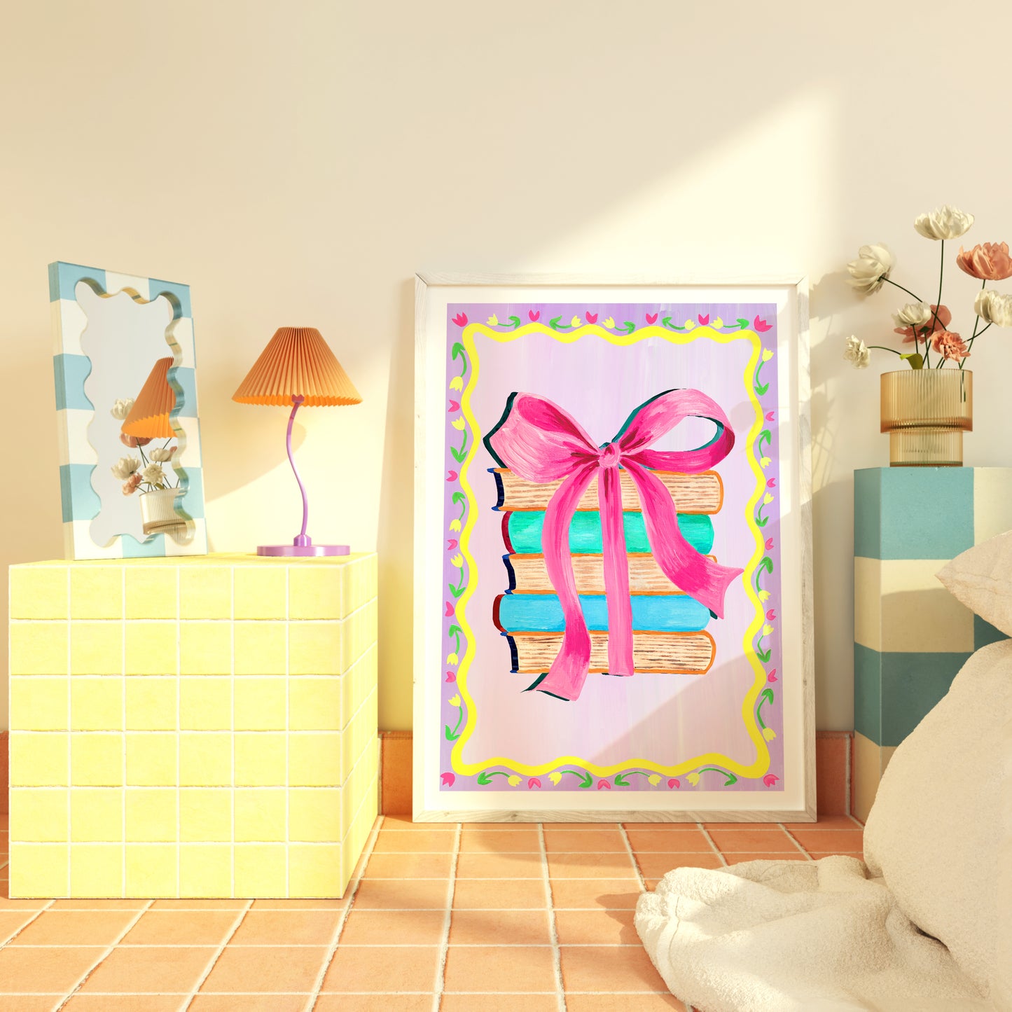 Framed artwork of books with a pink bow in a room setting.