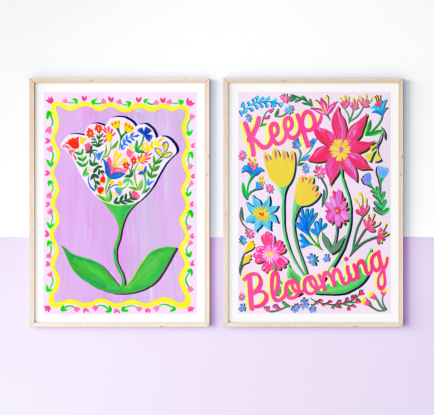 Two colorful floral prints with decorative frames on a light purple background