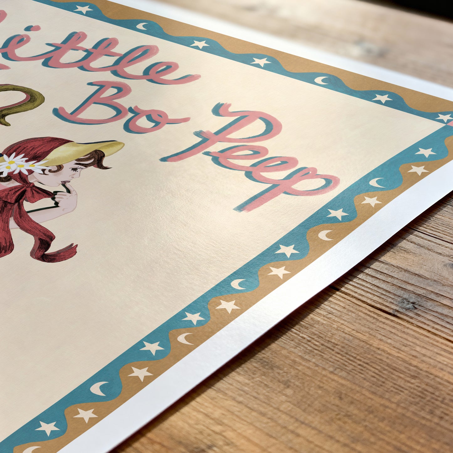 Poster of Little Bo Peep with decorative border on a wooden surface