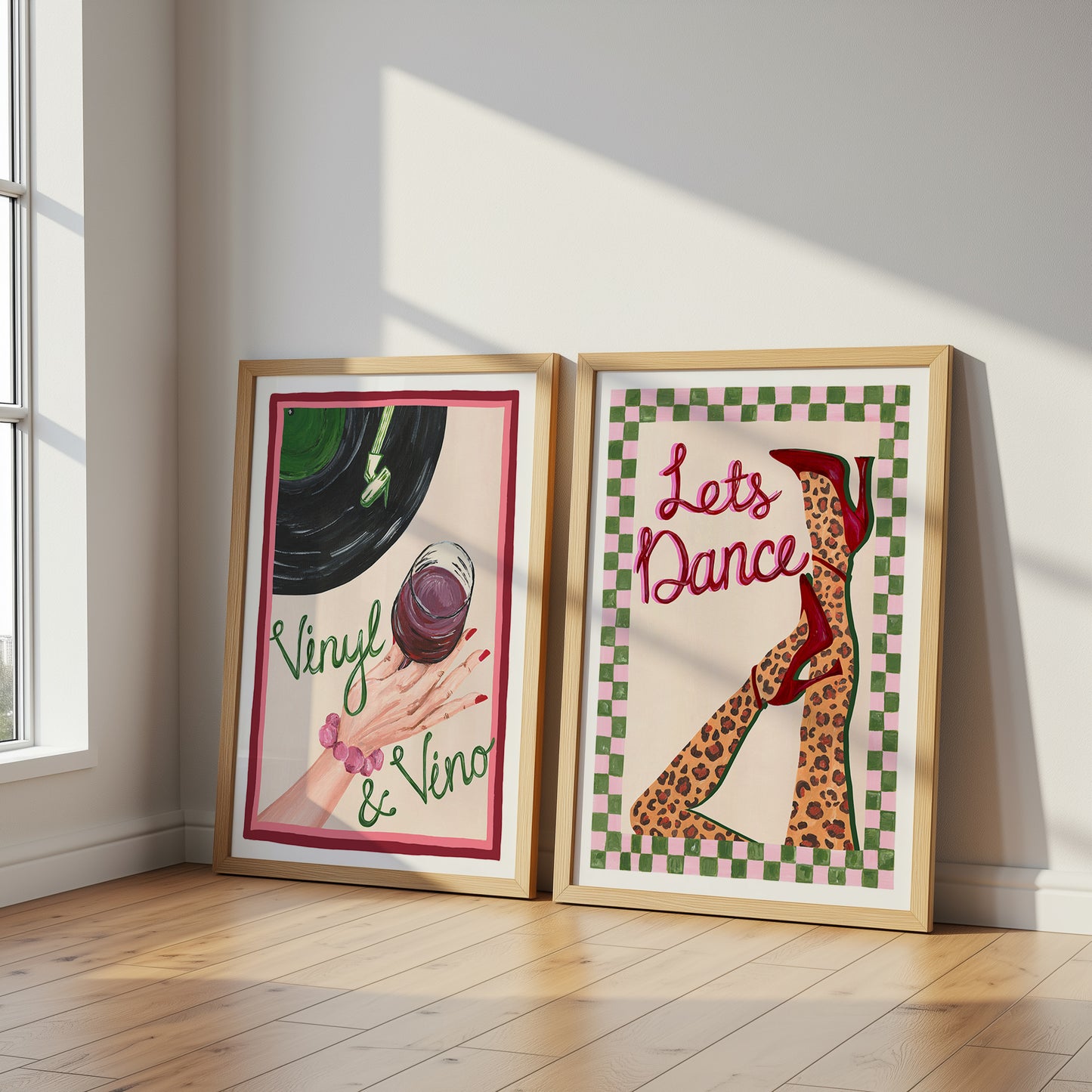 Two framed artworks on a wall with a window in the background