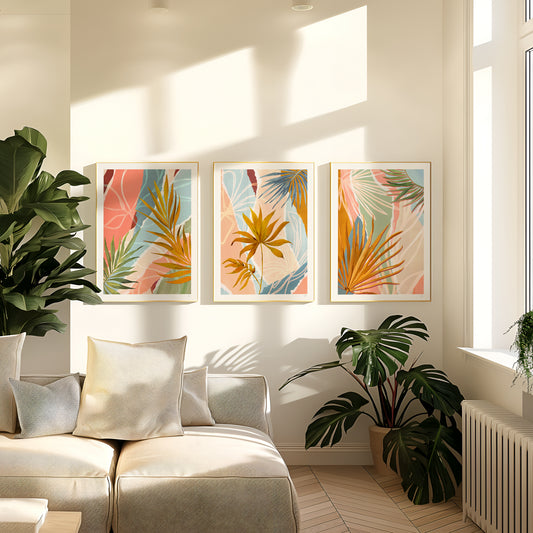 Living room with a beige sofa, decorative pillows, and wall art featuring tropical leaves.