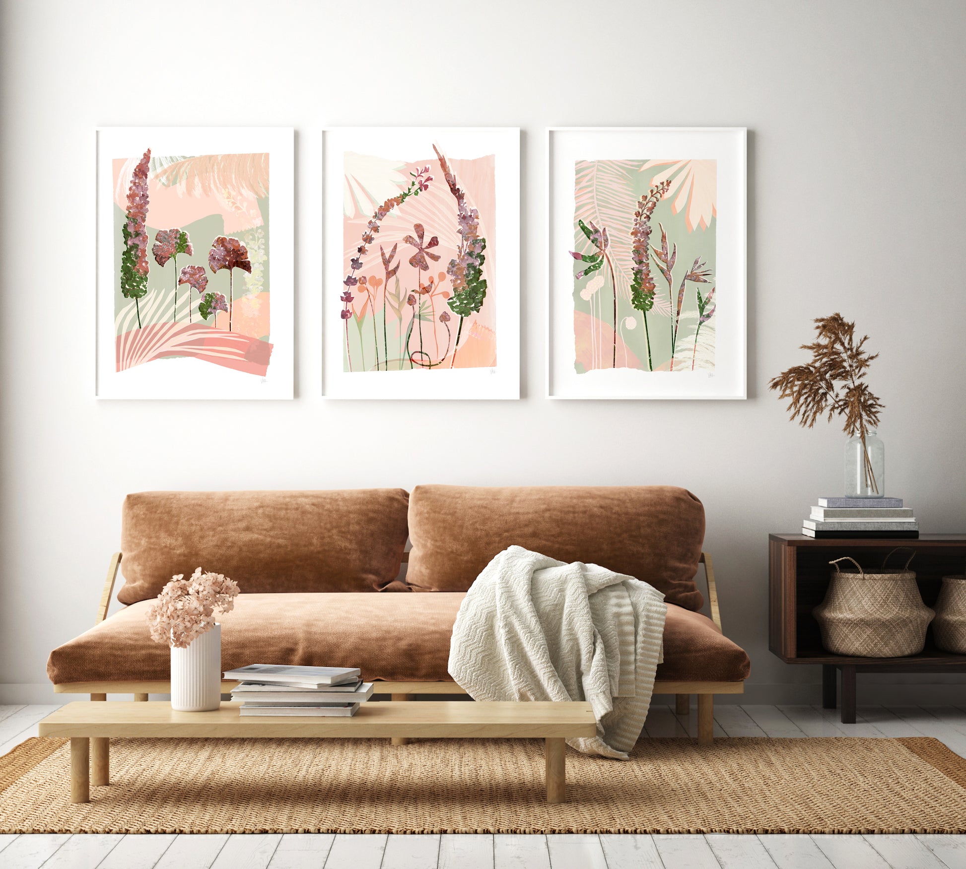 Living room with a brown sofa, coffee table, and wall art depicting floral designs.