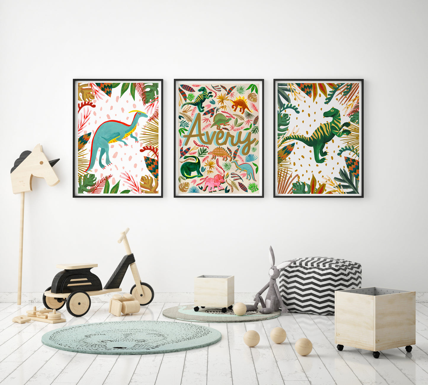 Three colorful dinosaur-themed wall posters in a child's room with toys and furniture.