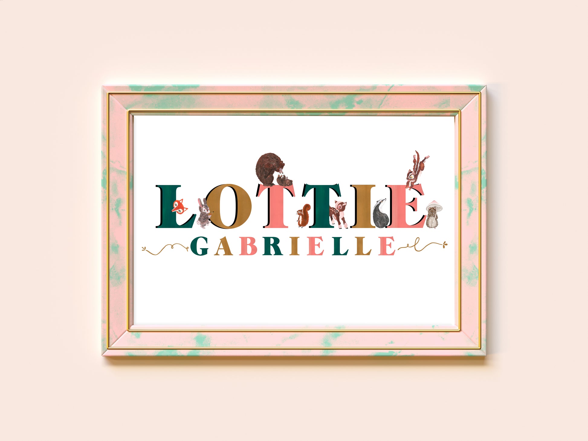 Framed artwork with 'Lottie Gabrielle' text and illustrations on a light pink background