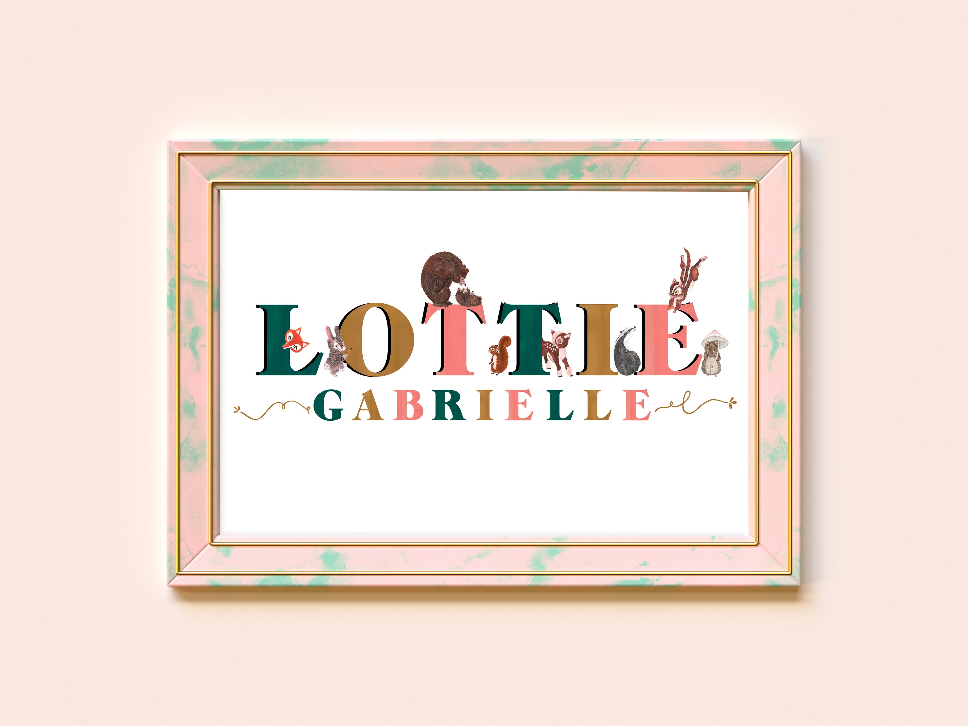 Framed artwork with 'Lottie Gabrielle' text and illustrations on a light pink background