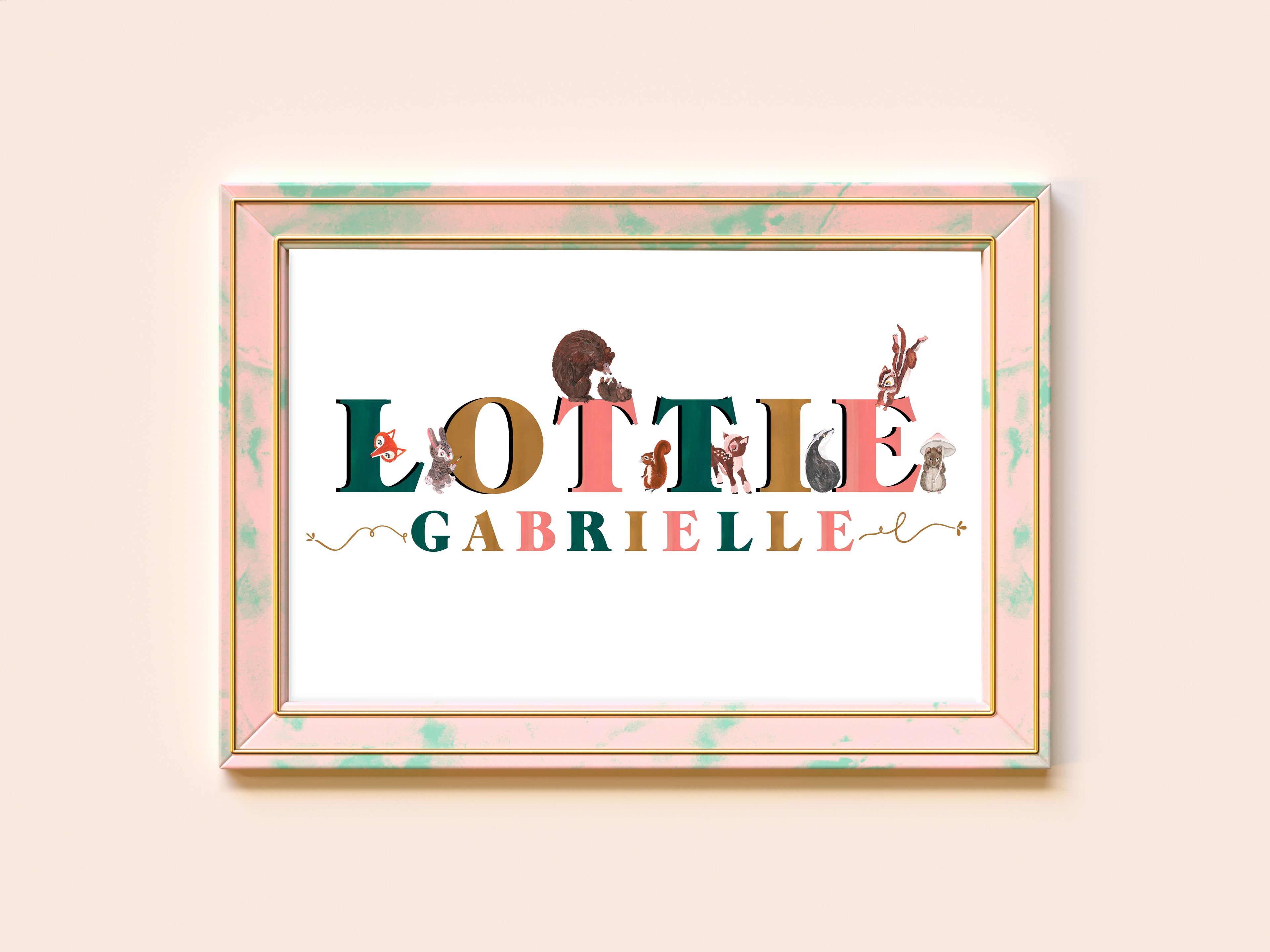 Framed artwork with 'Lottie Gabrielle' text and illustrations on a light pink background