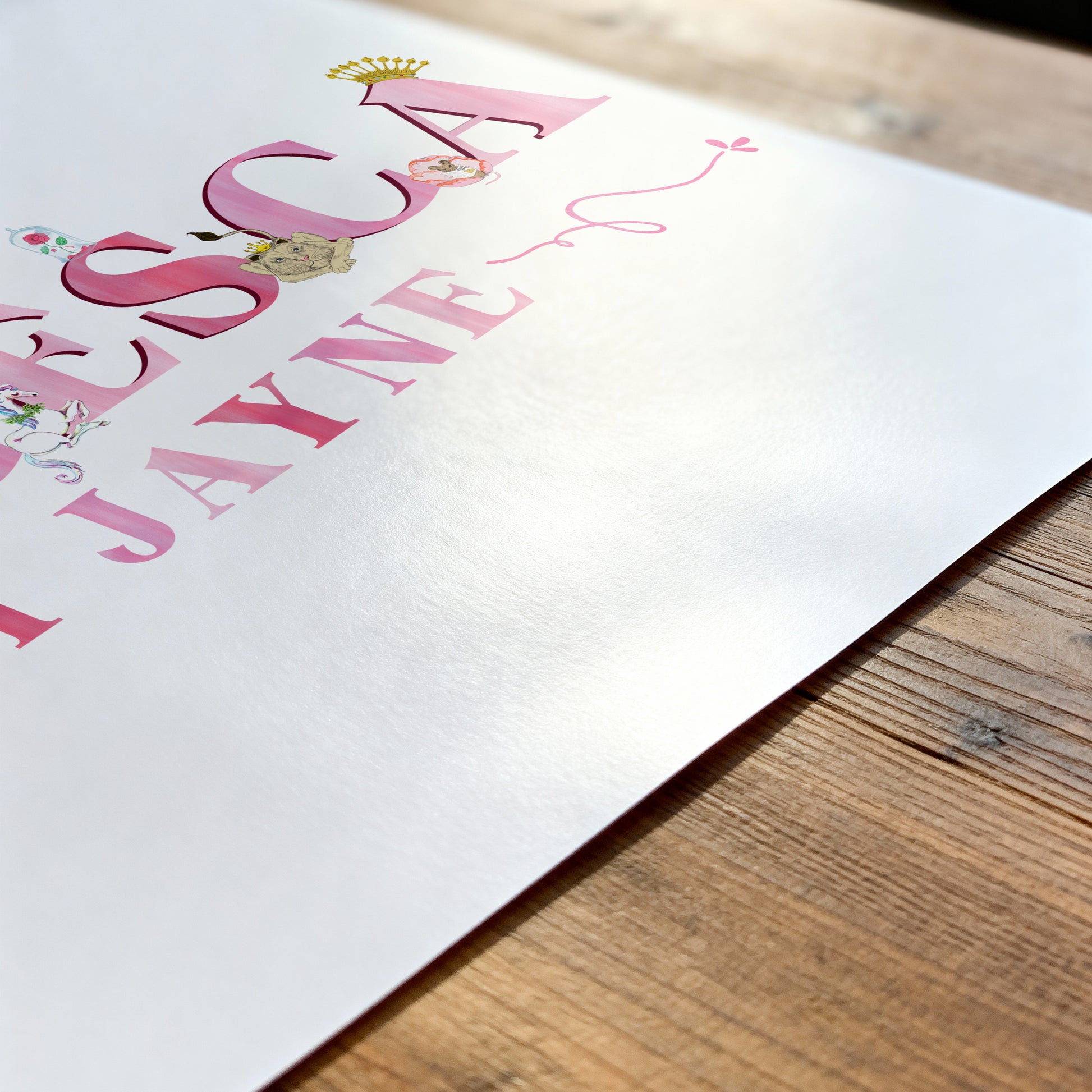 Personalized name print with decorative Fairytale illustrations on a wooden surfacee