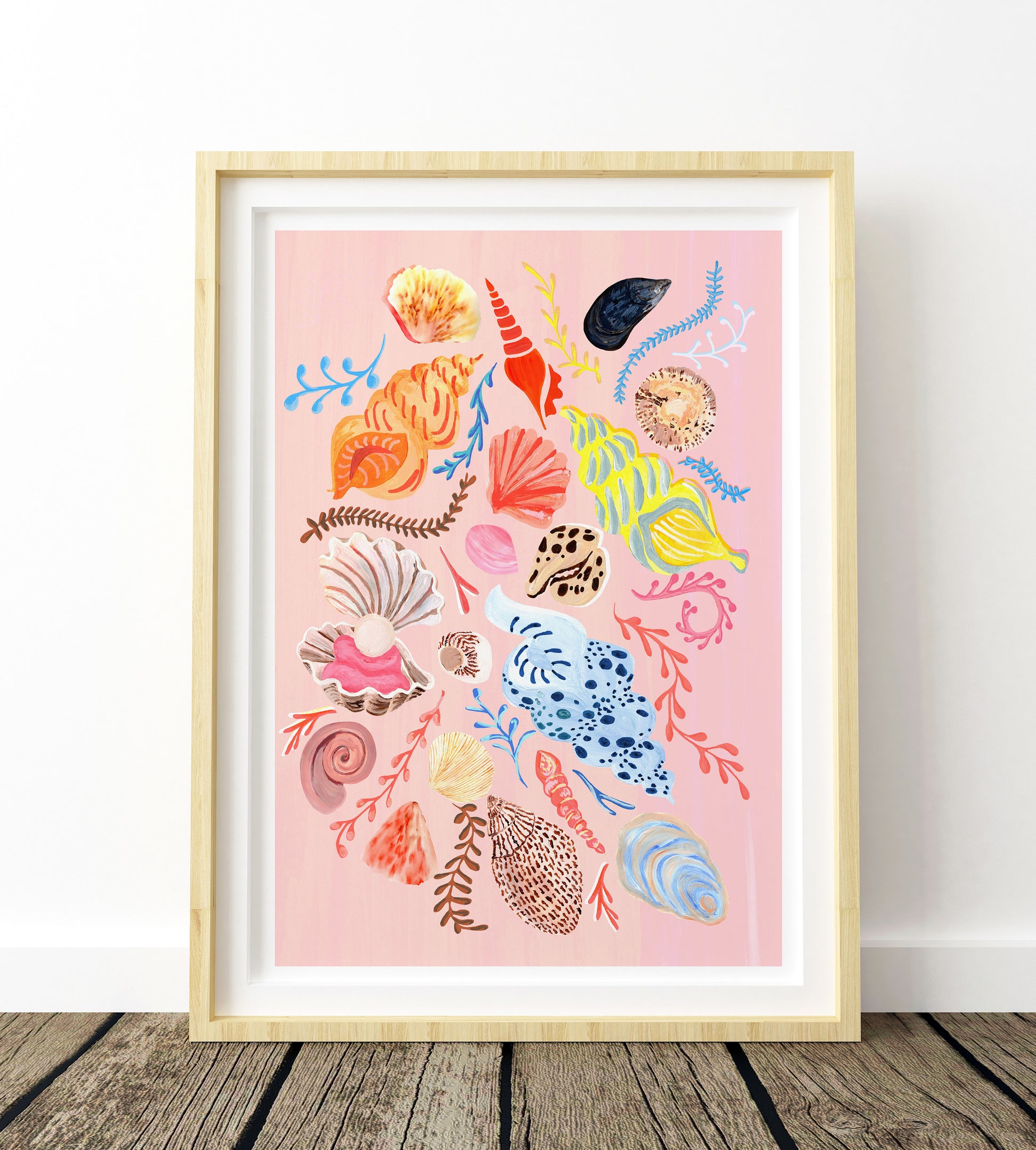 Framed artwork with colorful seashell illustrations on a pink background