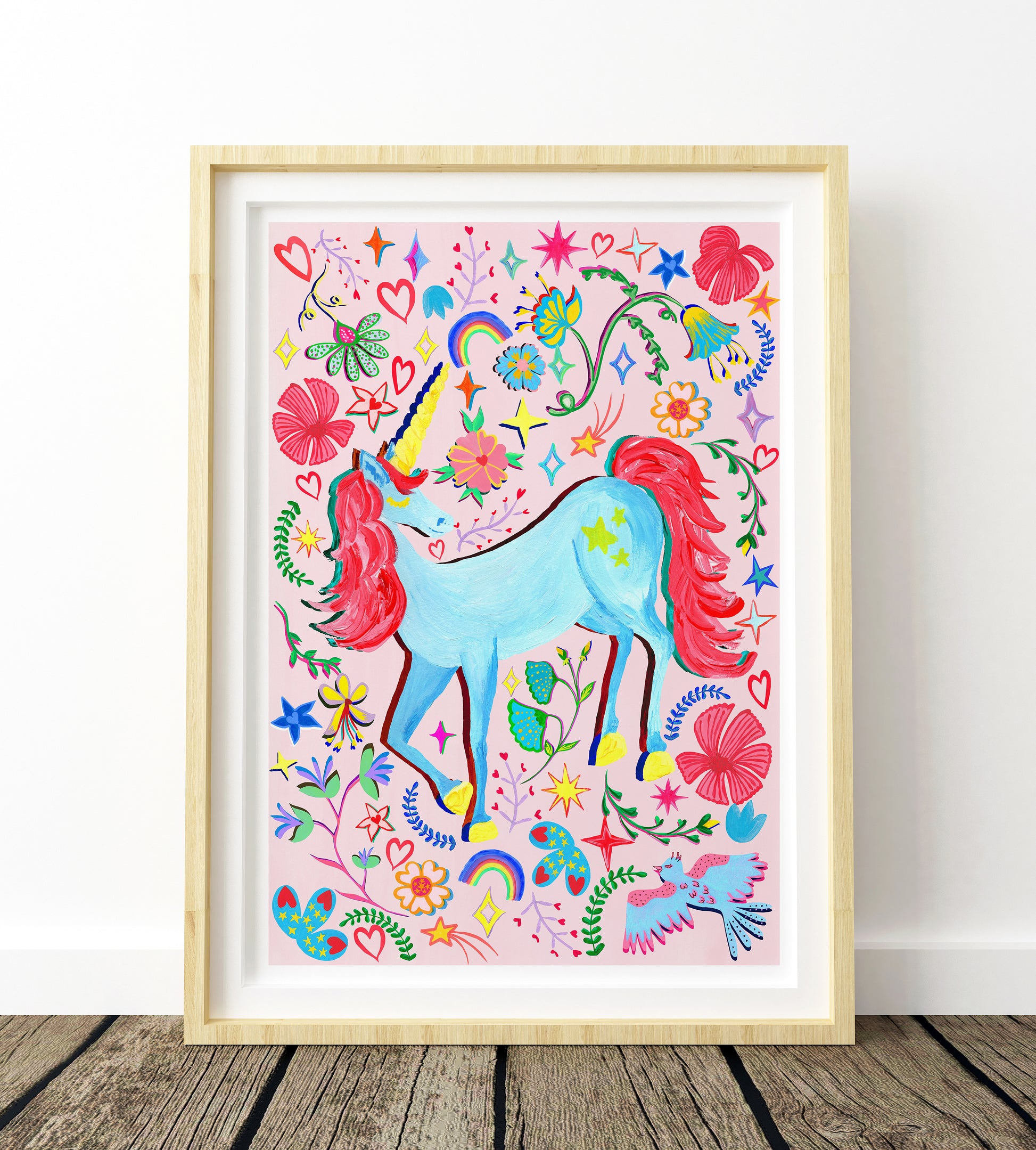 A colourful hand painted unicorn nursery print