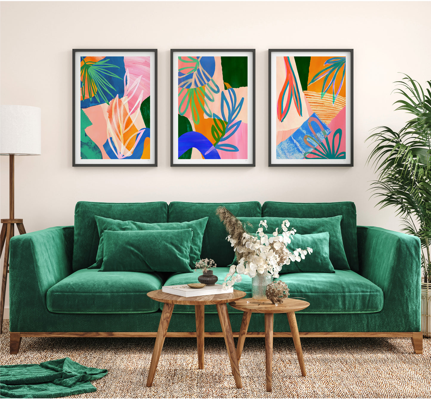 Green sofa in a living room with colorful abstract art on the wall.