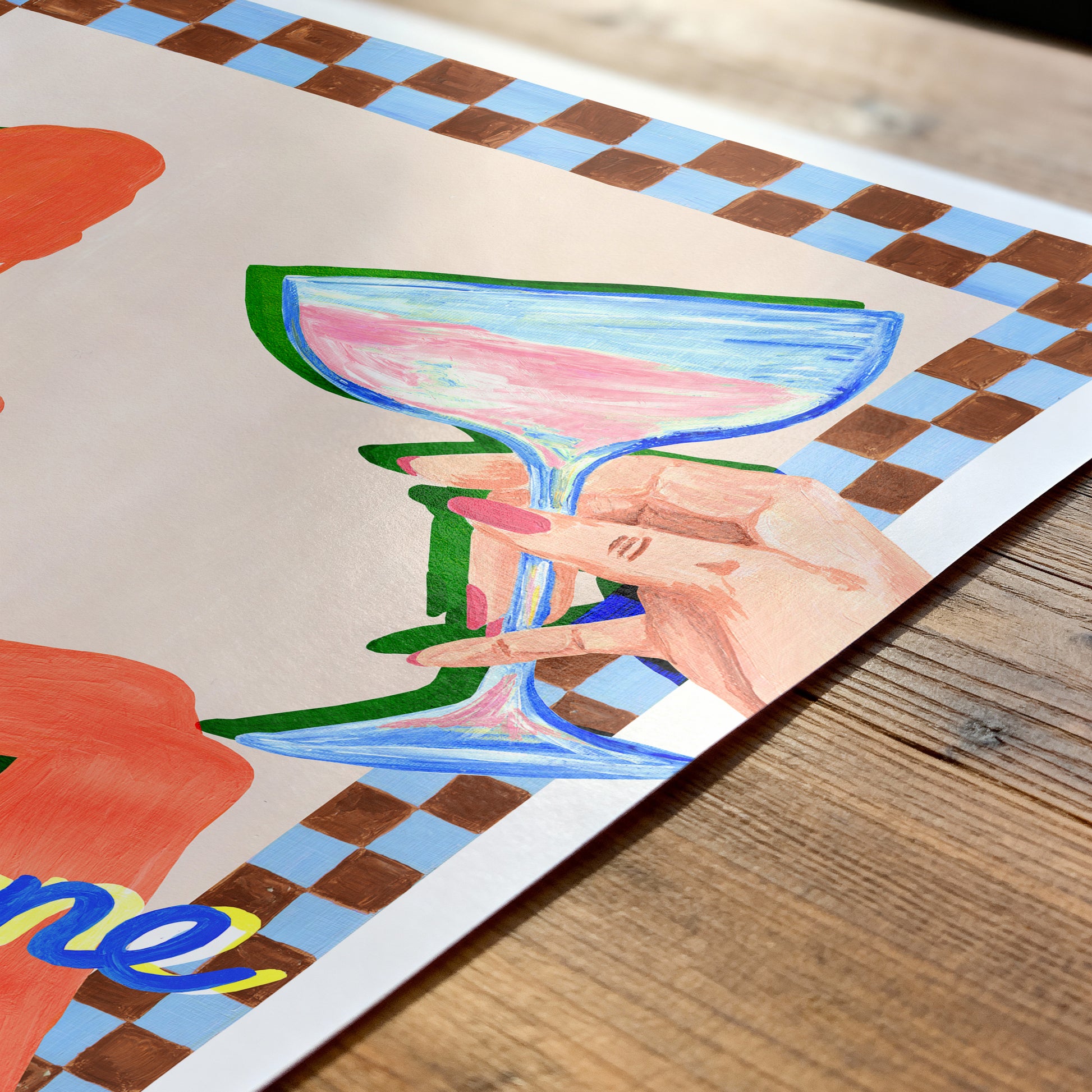 Colorful drawing of a hand holding a cocktail glass on a checkered tablecloth.