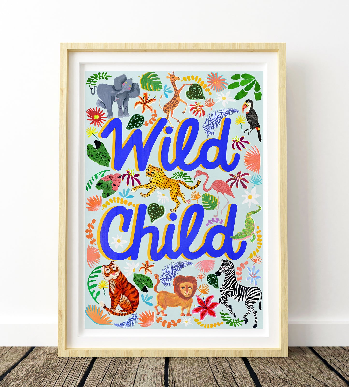 Framed artwork with 'Wild Child' text and animal illustrations on a white background