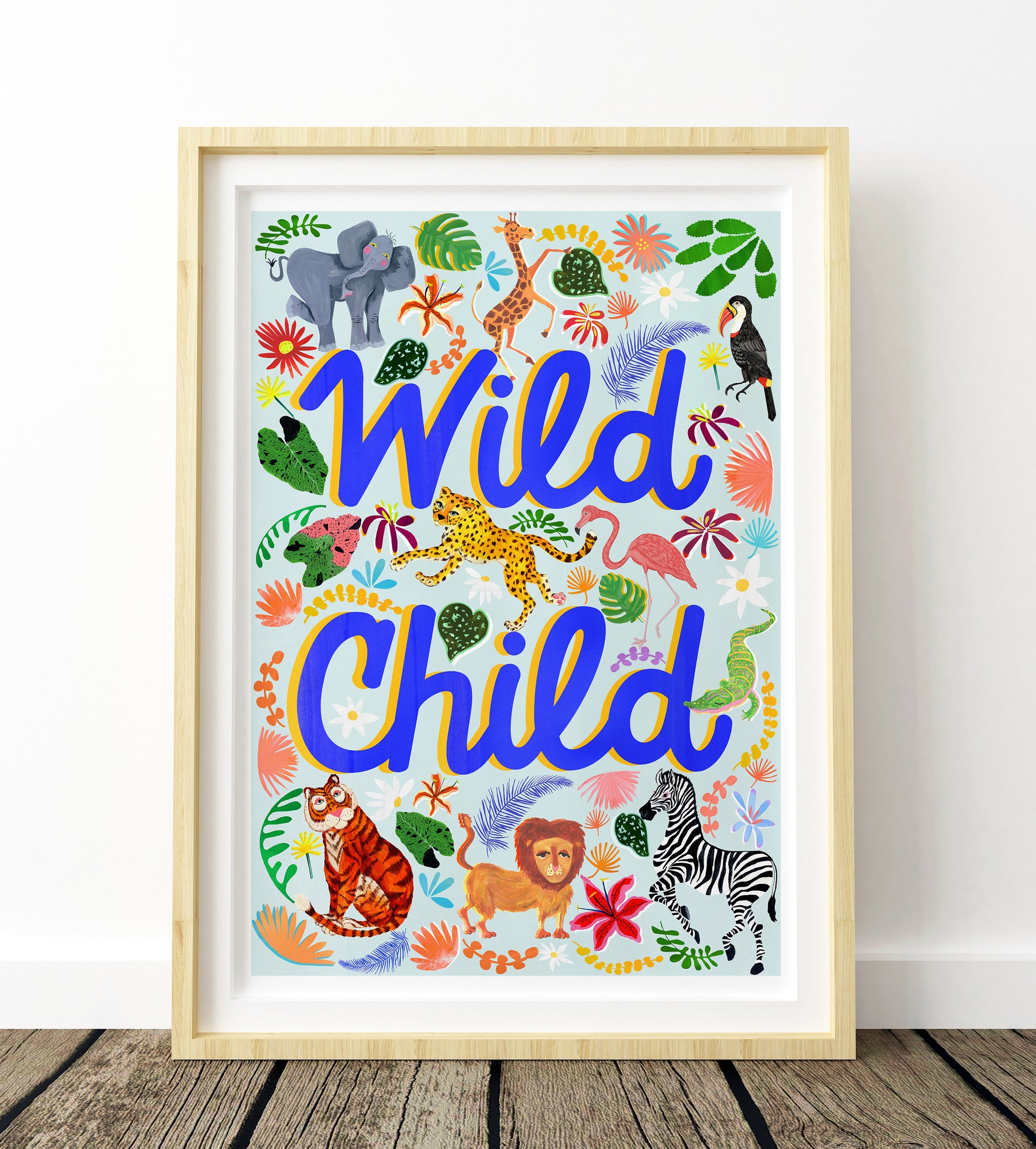Framed artwork with 'Wild Child' text and animal illustrations on a white background