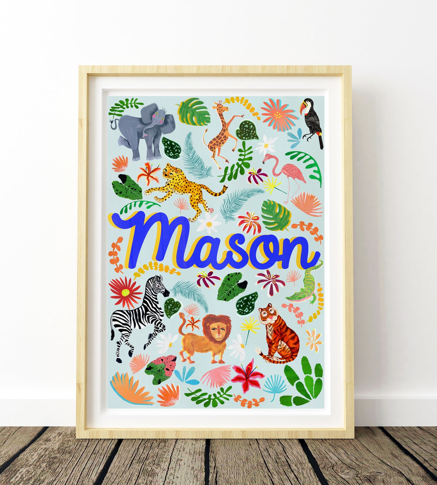 Framed children's name print with colorful animals and foliage on a white background